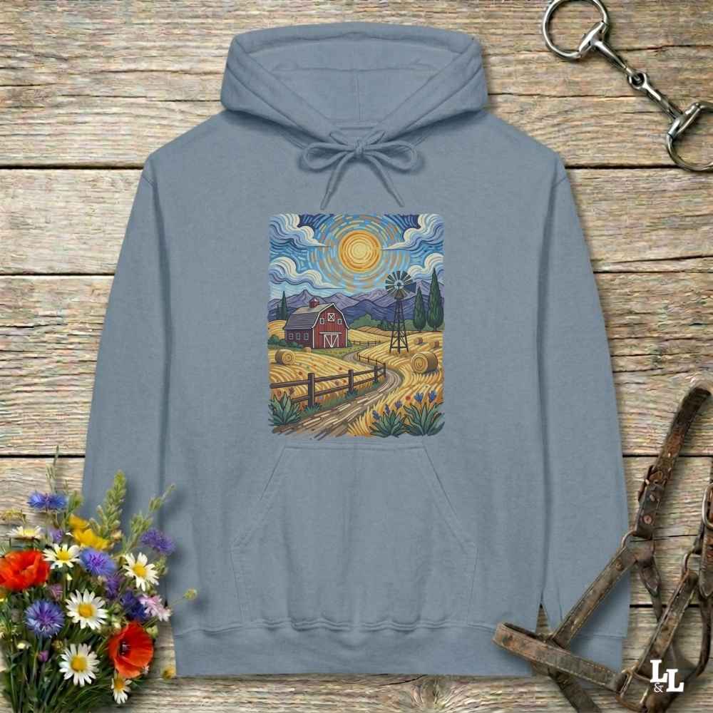 blue hoodie with a farm scene print on a wooden surface with flowers and horse equipment. Gogh to the Barn.