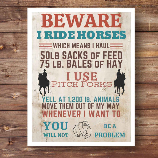 Rustic “Beware I Ride Horses” western print featuring bold typography and distressed finish, perfect for farmhouse wall decor. Country style horse lover artwork with western warning theme, ideal for entryway or barn wall display. Vintage western print.