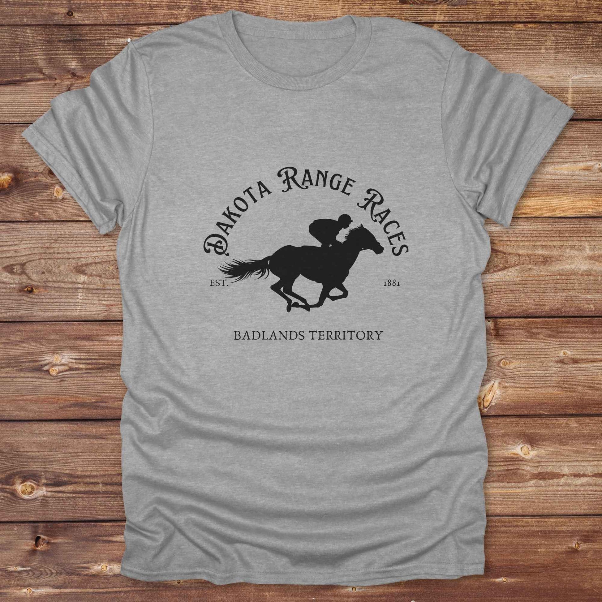 Fun western t-shirt for horse lovers and cowgirls. Western cowgirl graphic tee with horse design. Cowboy humor t-shirt for rodeo and country lovers. Horse lover funny t-shirt with western theme. Country style horse graphic tee for cowboys and cowgirls. Retro style funny western shirt for equestrians. Cute and funny country shirt with horse print. Southern cowgirl funny quote shirt for horse lovers. Dakota Range Races Badlands Territory.