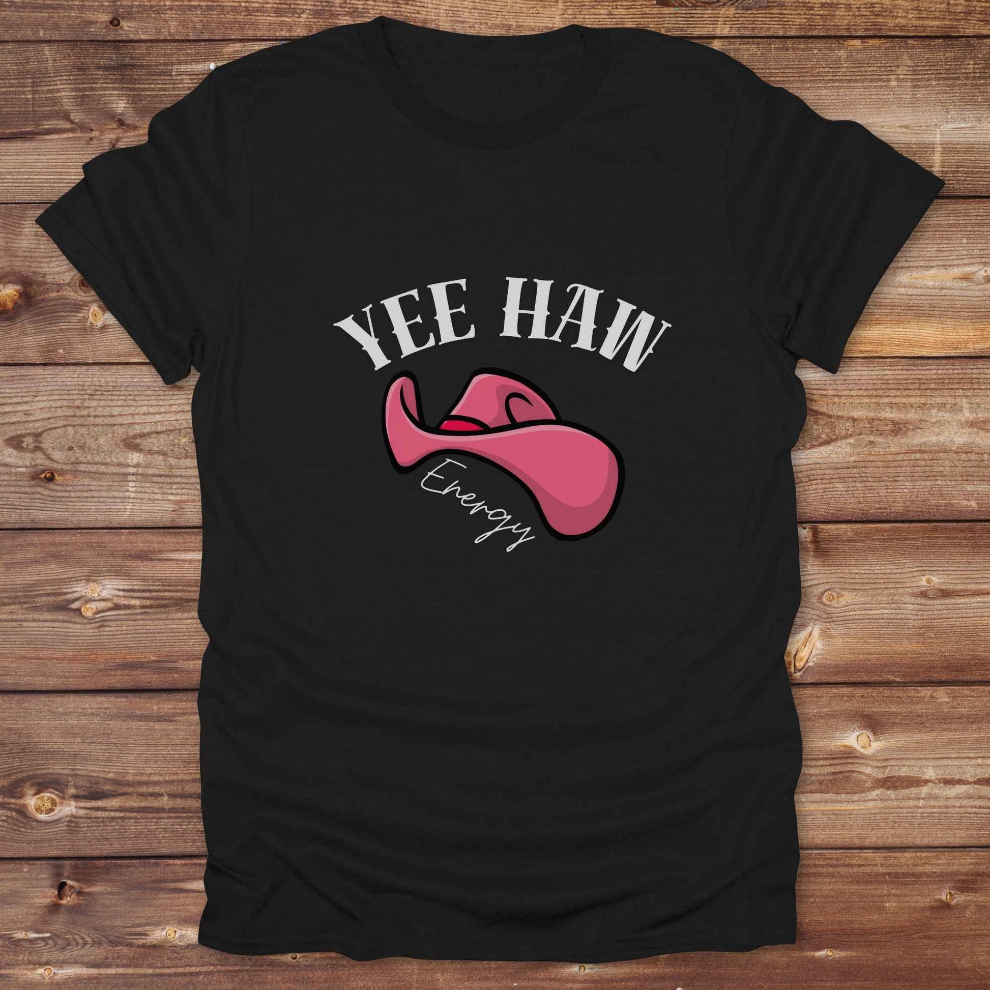 Fun western t-shirt for horse lovers and cowgirls. Western cowgirl graphic tee with horse design. Cowboy humor t-shirt for rodeo and country lovers. Horse lover funny t-shirt with western theme. Country style horse graphic tee for cowboys and cowgirls. Retro style funny western shirt for equestrians. Cute and funny country shirt with horse print. Southern cowgirl funny quote shirt for horse lovers. Yee Haw Energy with Pink Cowgirl Hat.