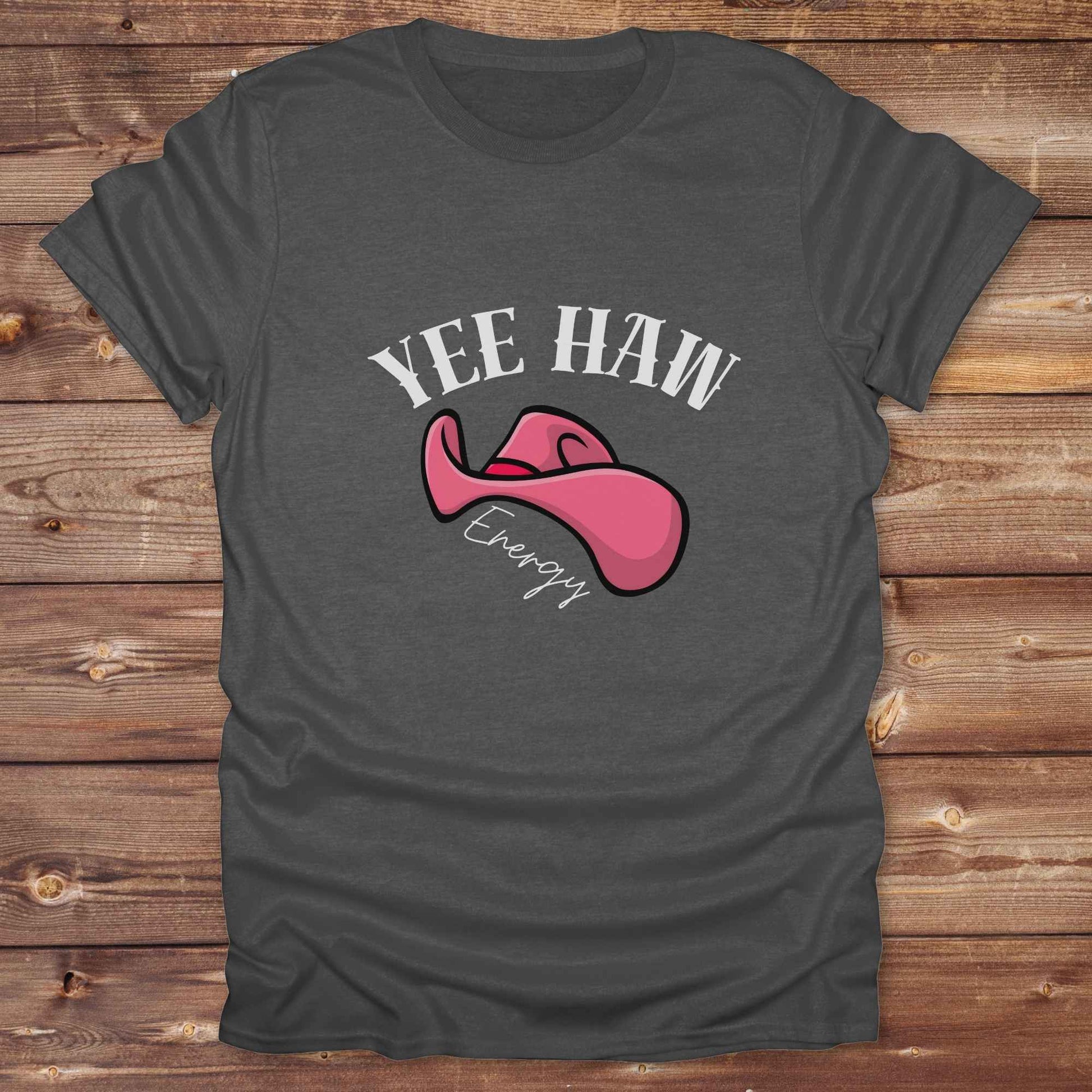 Fun western t-shirt for horse lovers and cowgirls. Western cowgirl graphic tee with horse design. Cowboy humor t-shirt for rodeo and country lovers. Horse lover funny t-shirt with western theme. Country style horse graphic tee for cowboys and cowgirls. Retro style funny western shirt for equestrians. Cute and funny country shirt with horse print. Southern cowgirl funny quote shirt for horse lovers. Yee Haw Energy with Pink Cowgirl Hat.