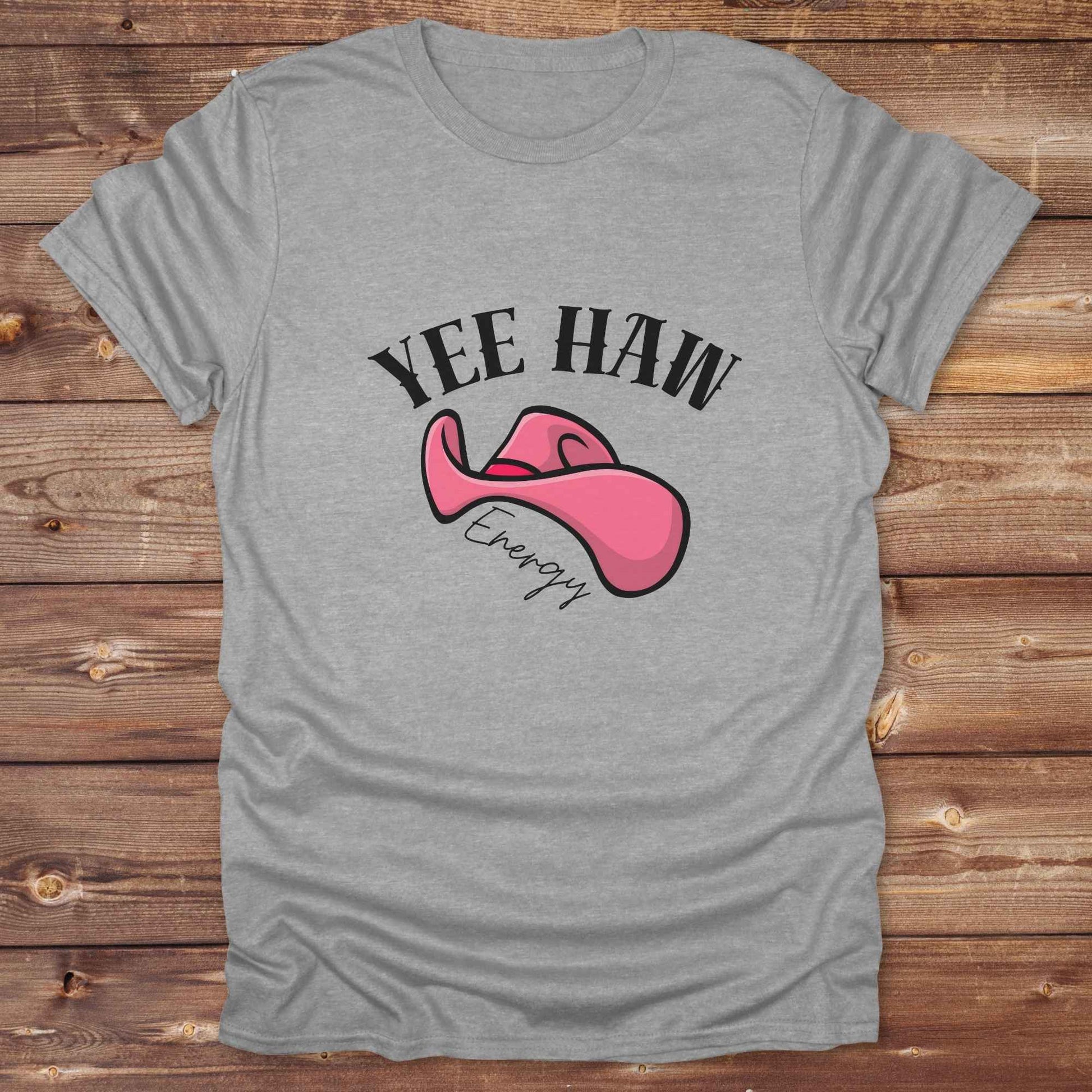 Fun western t-shirt for horse lovers and cowgirls. Western cowgirl graphic tee with horse design. Cowboy humor t-shirt for rodeo and country lovers. Horse lover funny t-shirt with western theme. Country style horse graphic tee for cowboys and cowgirls. Retro style funny western shirt for equestrians. Cute and funny country shirt with horse print. Southern cowgirl funny quote shirt for horse lovers. Yee Haw Energy with Pink Cowgirl Hat.