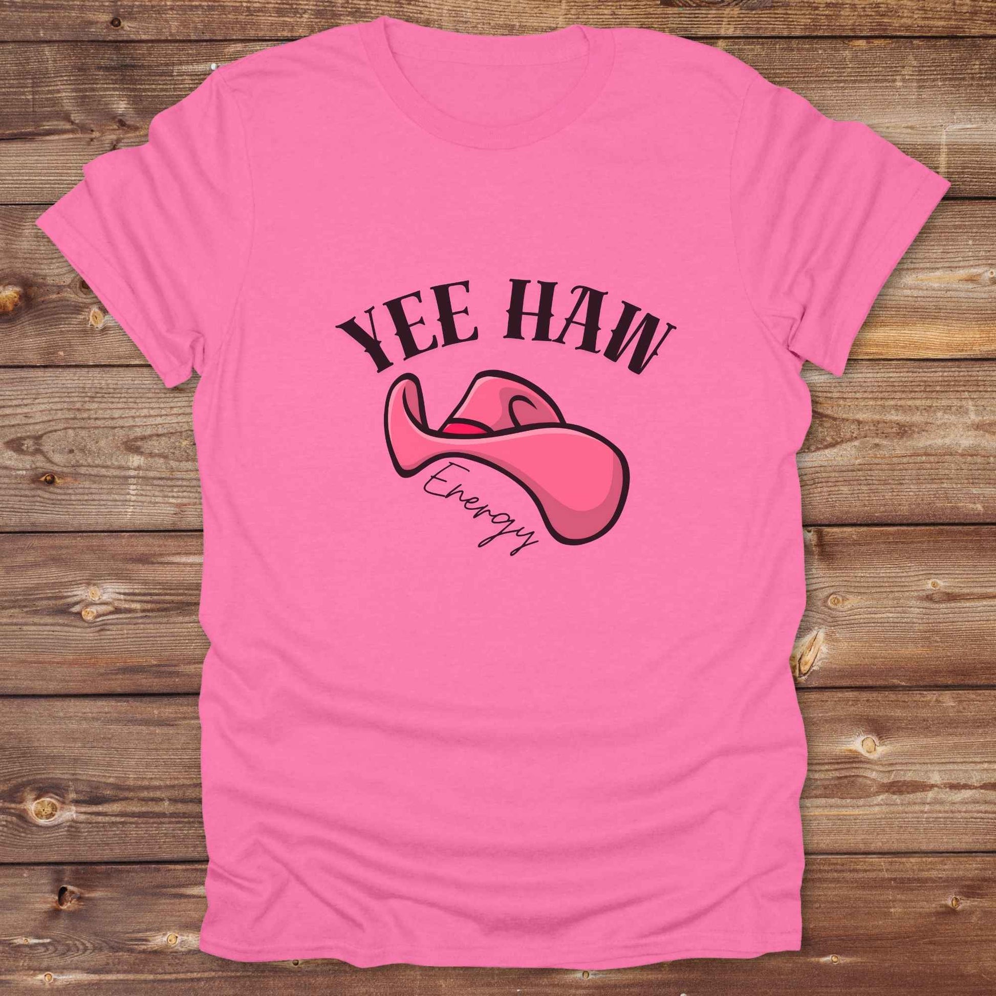 Fun western t-shirt for horse lovers and cowgirls. Western cowgirl graphic tee with horse design. Cowboy humor t-shirt for rodeo and country lovers. Horse lover funny t-shirt with western theme. Country style horse graphic tee for cowboys and cowgirls. Retro style funny western shirt for equestrians. Cute and funny country shirt with horse print. Southern cowgirl funny quote shirt for horse lovers. Yee Haw Energy with Pink Cowgirl Hat.