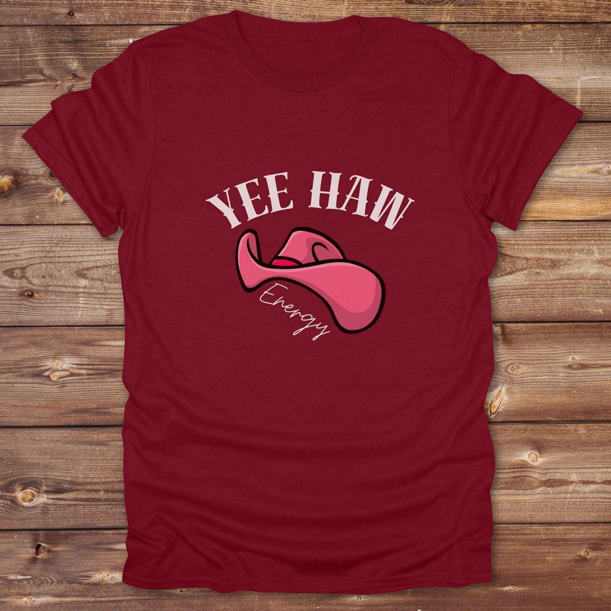 Fun western t-shirt for horse lovers and cowgirls. Western cowgirl graphic tee with horse design. Cowboy humor t-shirt for rodeo and country lovers. Horse lover funny t-shirt with western theme. Country style horse graphic tee for cowboys and cowgirls. Retro style funny western shirt for equestrians. Cute and funny country shirt with horse print. Southern cowgirl funny quote shirt for horse lovers. Yee Haw Energy with Pink Cowgirl Hat.