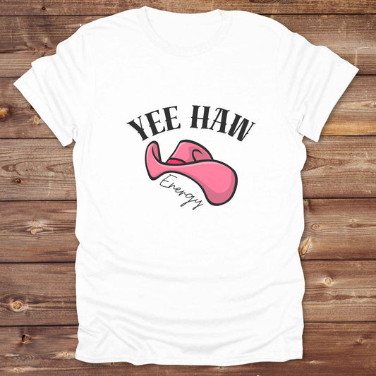 Fun western t-shirt for horse lovers and cowgirls. Western cowgirl graphic tee with horse design. Cowboy humor t-shirt for rodeo and country lovers. Horse lover funny t-shirt with western theme. Country style horse graphic tee for cowboys and cowgirls. Retro style funny western shirt for equestrians. Cute and funny country shirt with horse print. Southern cowgirl funny quote shirt for horse lovers. Yee Haw Energy with Pink Cowgirl Hat.