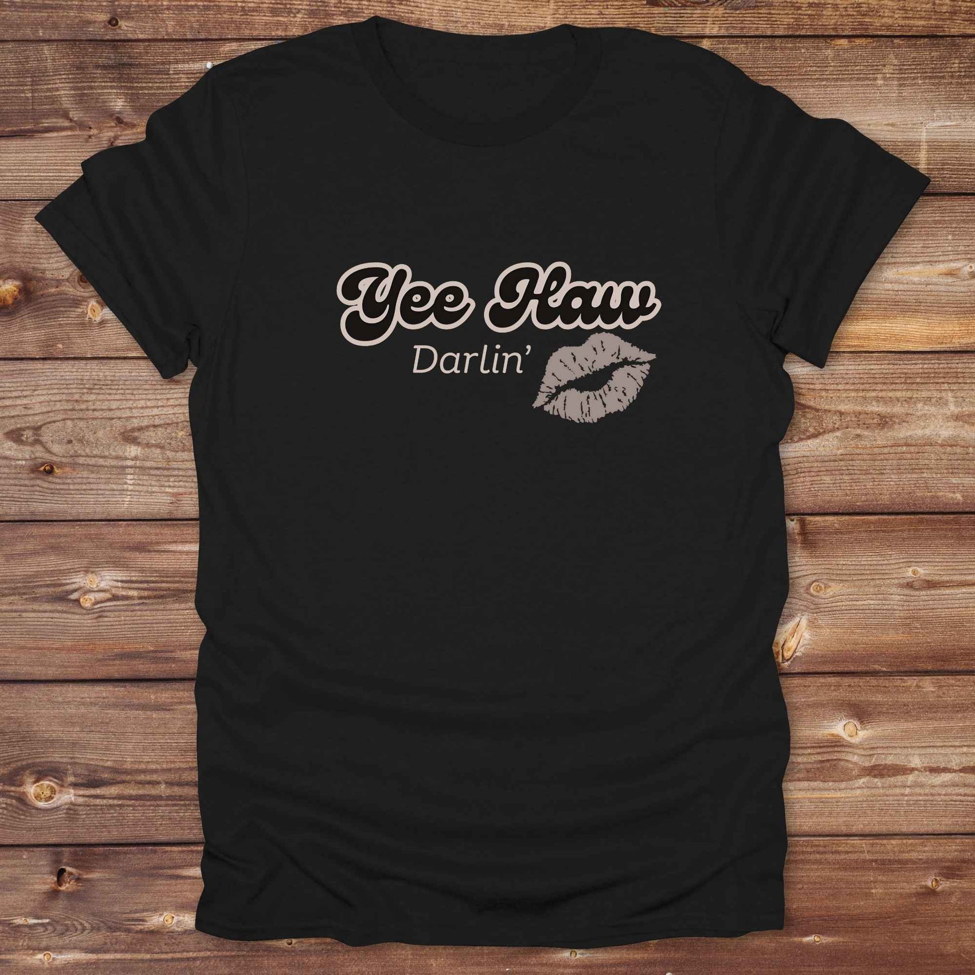 Fun western t-shirt for horse lovers and cowgirls. Western cowgirl graphic tee with horse design. Cowboy humor t-shirt for rodeo and country lovers. Horse lover funny t-shirt with western theme. Country style horse graphic tee for cowboys and cowgirls. Retro style funny western shirt for equestrians. Cute and funny country shirt with horse print. Southern cowgirl funny quote shirt for horse lovers. Yee Haw Darlin' Kiss.