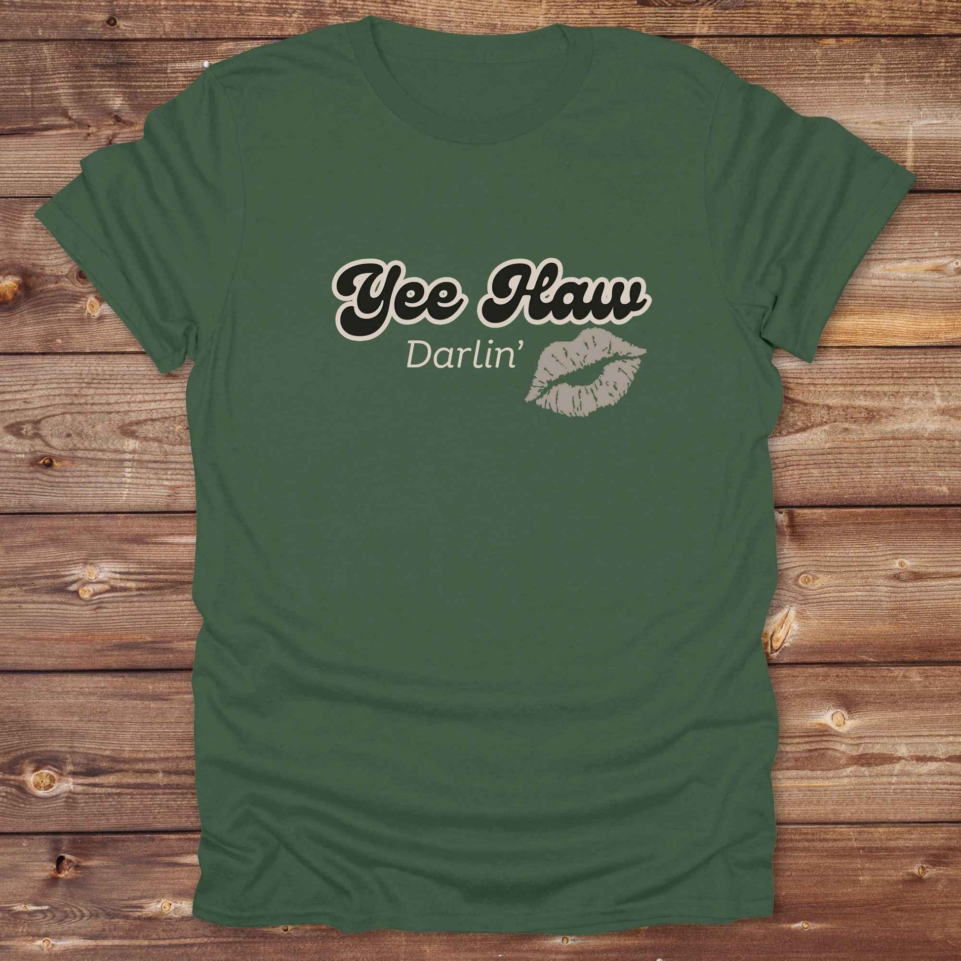 Fun western t-shirt for horse lovers and cowgirls. Western cowgirl graphic tee with horse design. Cowboy humor t-shirt for rodeo and country lovers. Horse lover funny t-shirt with western theme. Country style horse graphic tee for cowboys and cowgirls. Retro style funny western shirt for equestrians. Cute and funny country shirt with horse print. Southern cowgirl funny quote shirt for horse lovers. Yee Haw Darlin' Kiss.