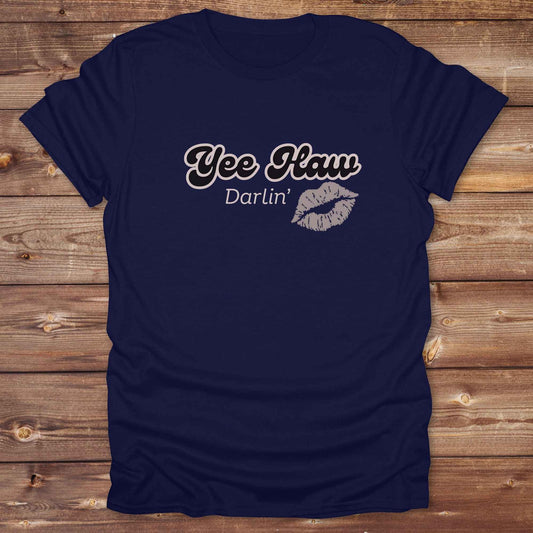 Fun western t-shirt for horse lovers and cowgirls. Western cowgirl graphic tee with horse design. Cowboy humor t-shirt for rodeo and country lovers. Horse lover funny t-shirt with western theme. Country style horse graphic tee for cowboys and cowgirls. Retro style funny western shirt for equestrians. Cute and funny country shirt with horse print. Southern cowgirl funny quote shirt for horse lovers. Yee Haw Darlin' Kiss.