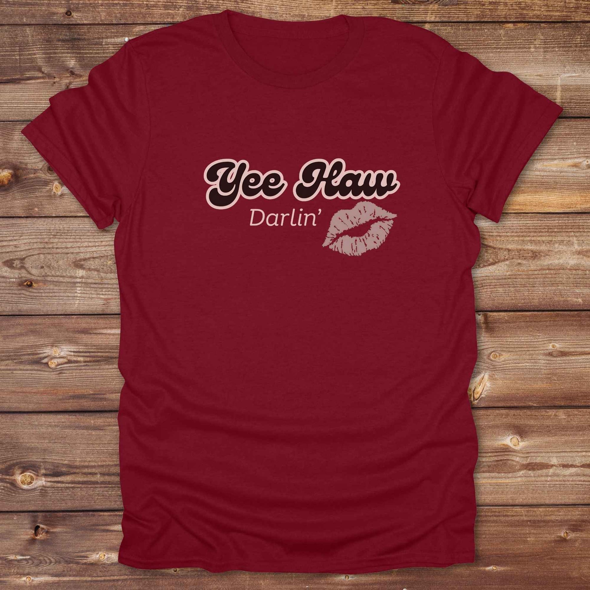 Fun western t-shirt for horse lovers and cowgirls. Western cowgirl graphic tee with horse design. Cowboy humor t-shirt for rodeo and country lovers. Horse lover funny t-shirt with western theme. Country style horse graphic tee for cowboys and cowgirls. Retro style funny western shirt for equestrians. Cute and funny country shirt with horse print. Southern cowgirl funny quote shirt for horse lovers. Yee Haw Darlin' Kiss.