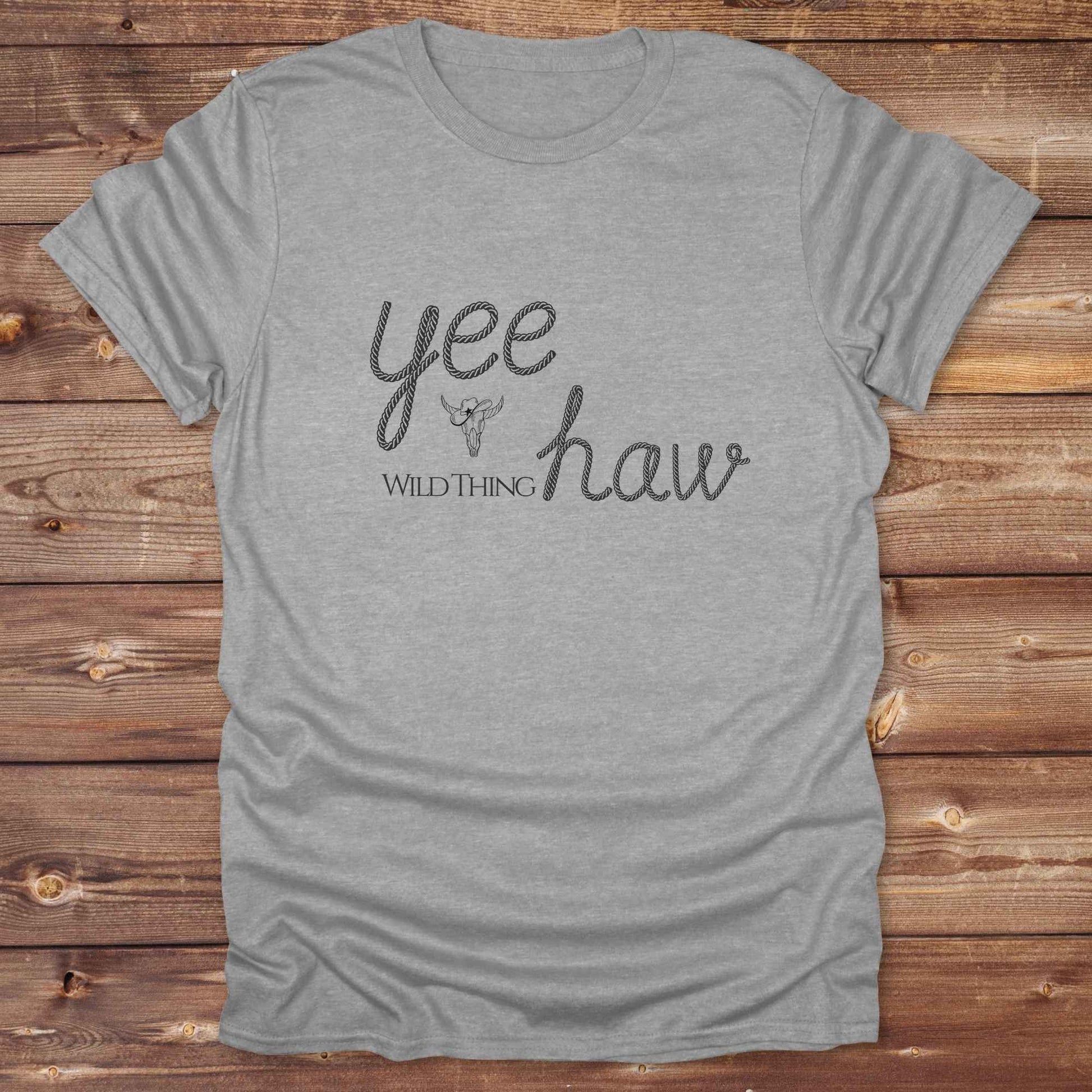 Fun western t-shirt for horse lovers and cowgirls. Western cowgirl graphic tee with horse design. Cowboy humor t-shirt for rodeo and country lovers. Horse lover funny t-shirt with western theme. Country style horse graphic tee for cowboys and cowgirls. Retro style funny western shirt for equestrians. Cute and funny country shirt with horse print. Southern cowgirl funny quote shirt for horse lovers. Yee Haw wild thing.