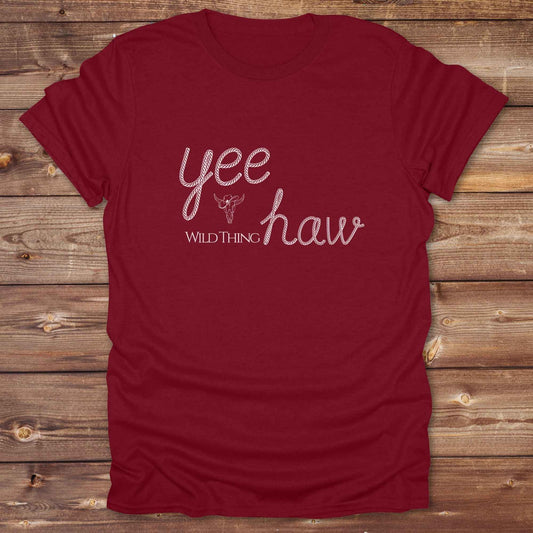 Fun western t-shirt for horse lovers and cowgirls. Western cowgirl graphic tee with horse design. Cowboy humor t-shirt for rodeo and country lovers. Horse lover funny t-shirt with western theme. Country style horse graphic tee for cowboys and cowgirls. Retro style funny western shirt for equestrians. Cute and funny country shirt with horse print. Southern cowgirl funny quote shirt for horse lovers. Yee Haw wild thing.