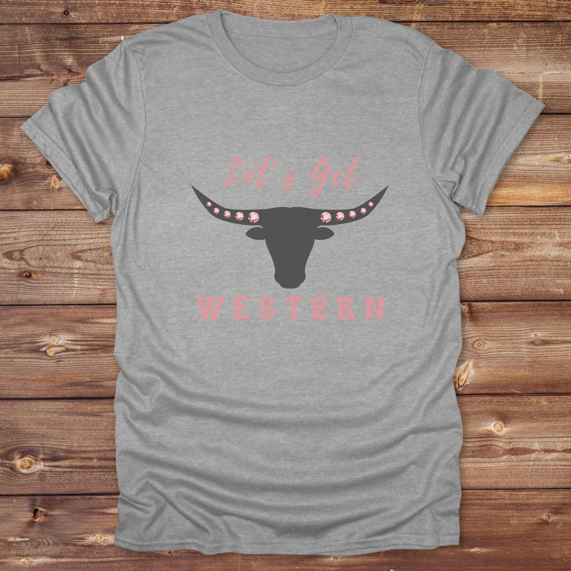 Fun western t-shirt for horse lovers and cowgirls. Western cowgirl graphic tee with horse design. Cowboy humor t-shirt for rodeo and country lovers. Horse lover funny t-shirt with western theme. Country style horse graphic tee for cowboys and cowgirls. Retro style funny western shirt for equestrians. Cute and funny country shirt with horse print. Southern cowgirl funny quote shirt for horse lovers. Lets get Western with longhorn skull and pink rhinestones.
