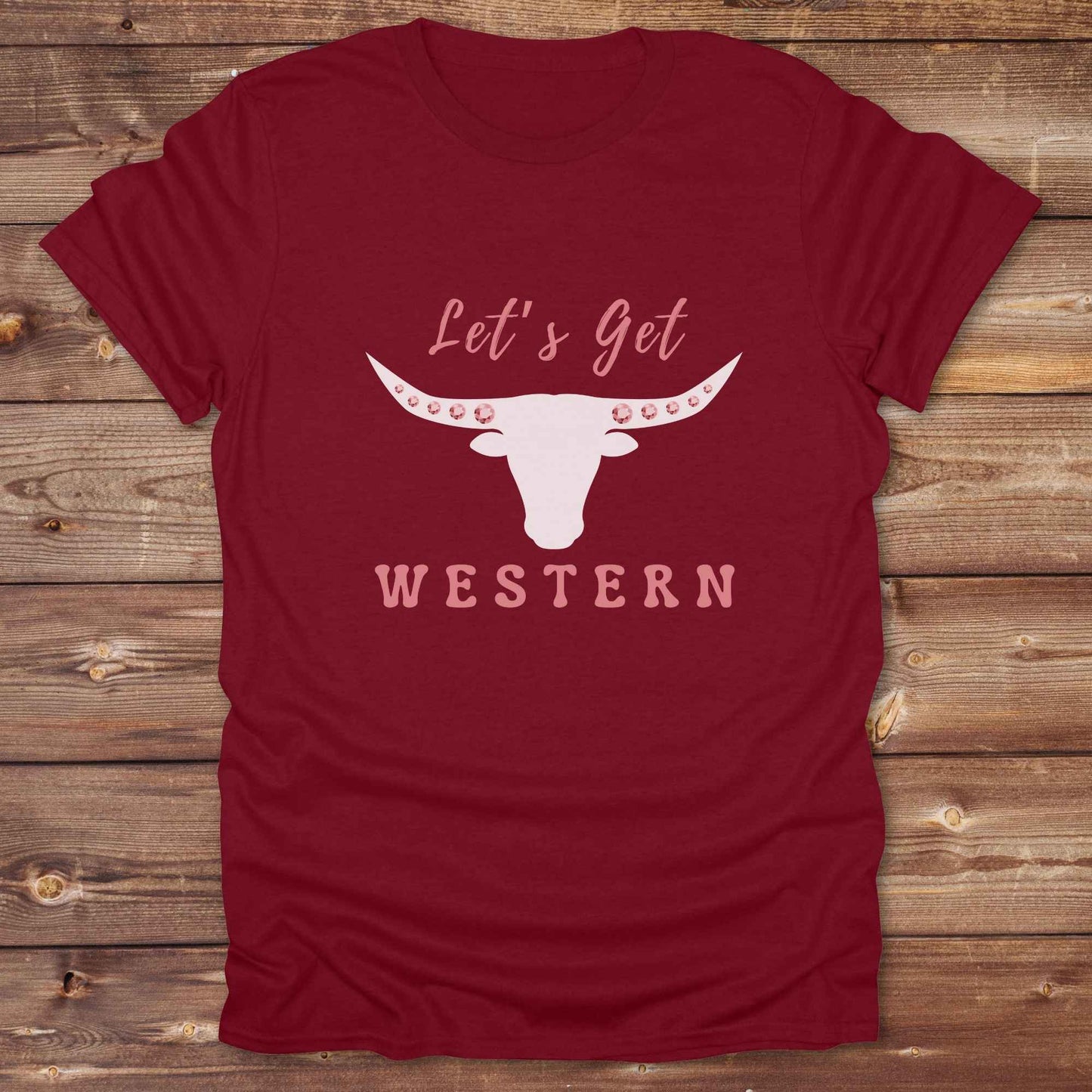 Fun western t-shirt for horse lovers and cowgirls. Western cowgirl graphic tee with horse design. Cowboy humor t-shirt for rodeo and country lovers. Horse lover funny t-shirt with western theme. Country style horse graphic tee for cowboys and cowgirls. Retro style funny western shirt for equestrians. Cute and funny country shirt with horse print. Southern cowgirl funny quote shirt for horse lovers. Lets get Western with longhorn skull and pink rhinestones.