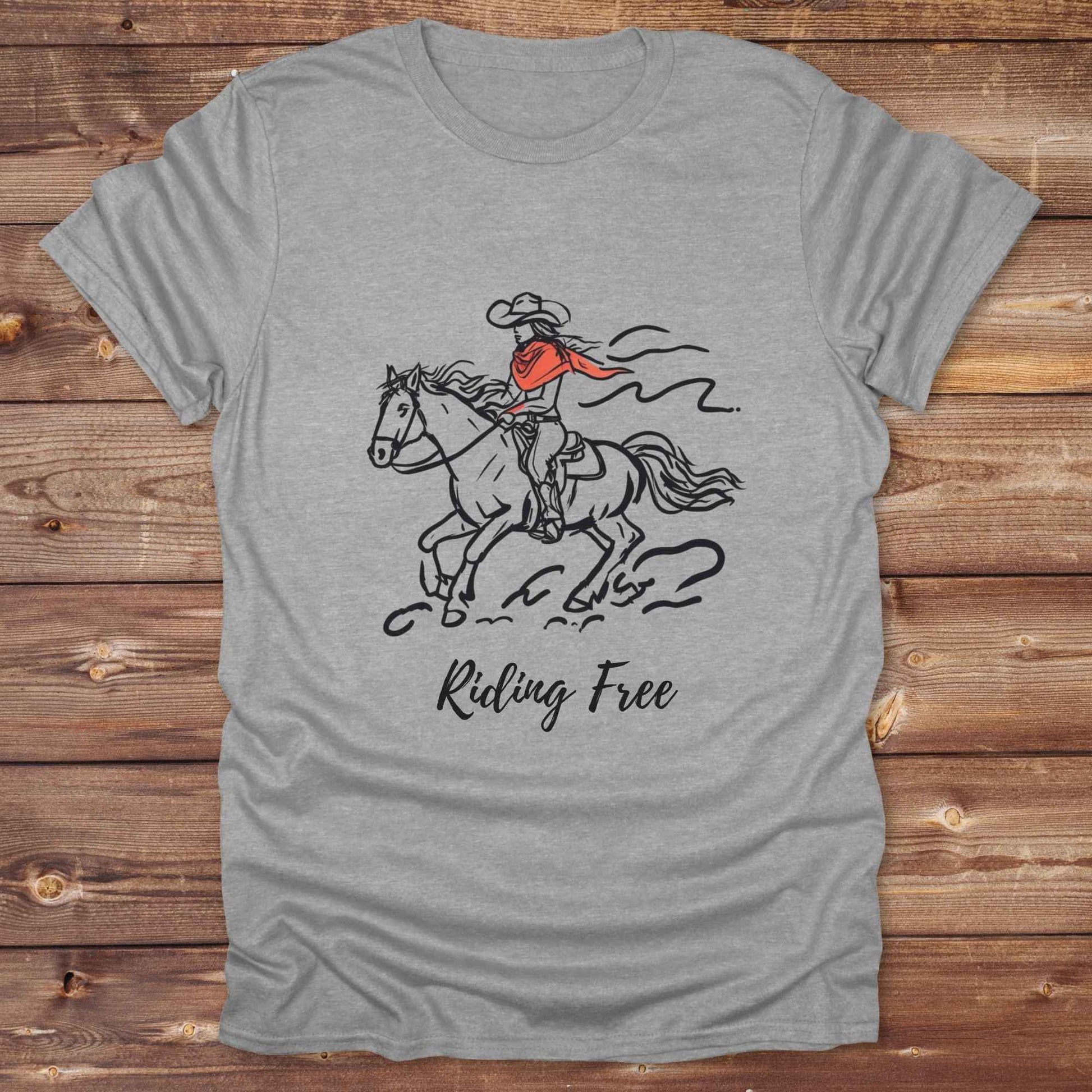 Fun western t-shirt for horse lovers and cowgirls. Western cowgirl graphic tee with horse design. Cowboy humor t-shirt for rodeo and country lovers. Horse lover funny t-shirt with western theme. Country style horse graphic tee for cowboys and cowgirls. Retro style funny western shirt for equestrians. Cute and funny country shirt with horse print. Southern cowgirl funny quote shirt for horse lovers. Riding Free.