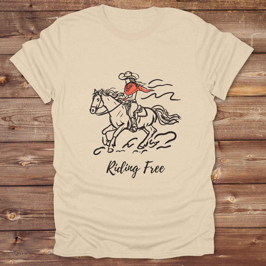 Fun western t-shirt for horse lovers and cowgirls. Western cowgirl graphic tee with horse design. Cowboy humor t-shirt for rodeo and country lovers. Horse lover funny t-shirt with western theme. Country style horse graphic tee for cowboys and cowgirls. Retro style funny western shirt for equestrians. Cute and funny country shirt with horse print. Southern cowgirl funny quote shirt for horse lovers. Riding Free.