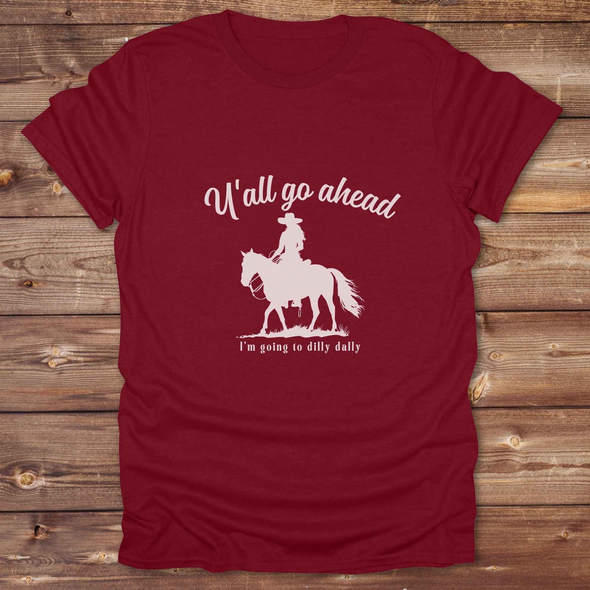 Fun western t-shirt for horse lovers and cowgirls. Western cowgirl graphic tee with horse design. Cowboy humor t-shirt for rodeo and country lovers. Horse lover funny t-shirt with western theme. Country style horse graphic tee for cowboys and cowgirls. Retro style funny western shirt for equestrians. Cute and funny country shirt with horse print. Southern cowgirl funny quote shirt for horse lovers. If Y'all go ahead.