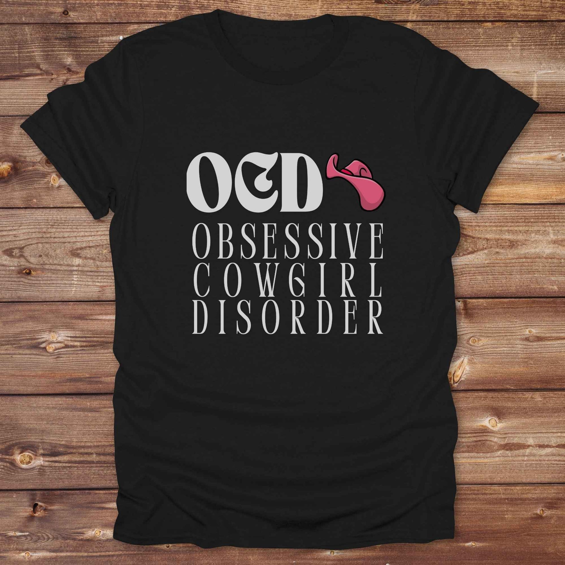 Fun western t-shirt for horse lovers and cowgirls. Western cowgirl graphic tee with horse design. Cowboy humor t-shirt for rodeo and country lovers. Horse lover funny t-shirt with western theme. Country style horse graphic tee for cowboys and cowgirls. Retro style funny western shirt for equestrians. Cute and funny country shirt with horse print. Southern cowgirl funny quote shirt for horse lovers. OCD Cowgirl.