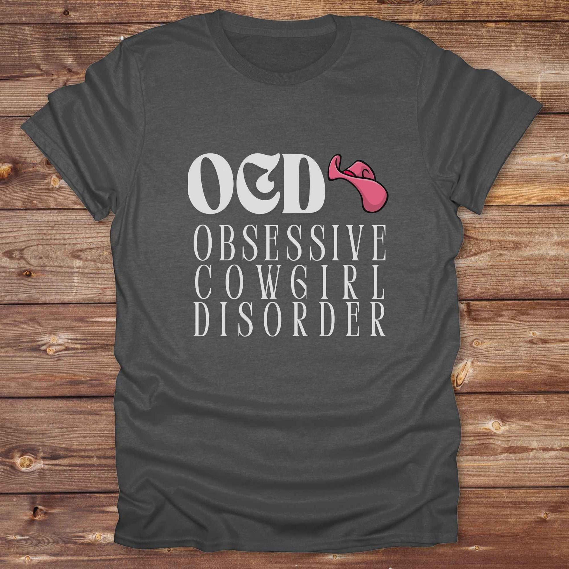 Fun western t-shirt for horse lovers and cowgirls. Western cowgirl graphic tee with horse design. Cowboy humor t-shirt for rodeo and country lovers. Horse lover funny t-shirt with western theme. Country style horse graphic tee for cowboys and cowgirls. Retro style funny western shirt for equestrians. Cute and funny country shirt with horse print. Southern cowgirl funny quote shirt for horse lovers. OCD Cowgirl.