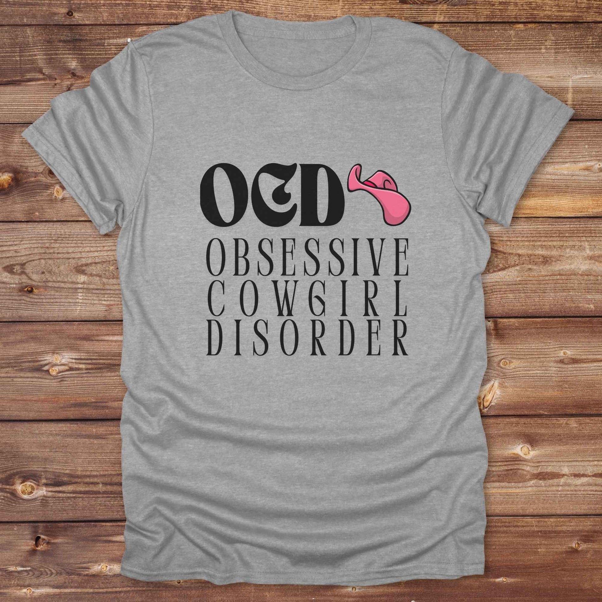 Fun western t-shirt for horse lovers and cowgirls. Western cowgirl graphic tee with horse design. Cowboy humor t-shirt for rodeo and country lovers. Horse lover funny t-shirt with western theme. Country style horse graphic tee for cowboys and cowgirls. Retro style funny western shirt for equestrians. Cute and funny country shirt with horse print. Southern cowgirl funny quote shirt for horse lovers. OCD Cowgirl.