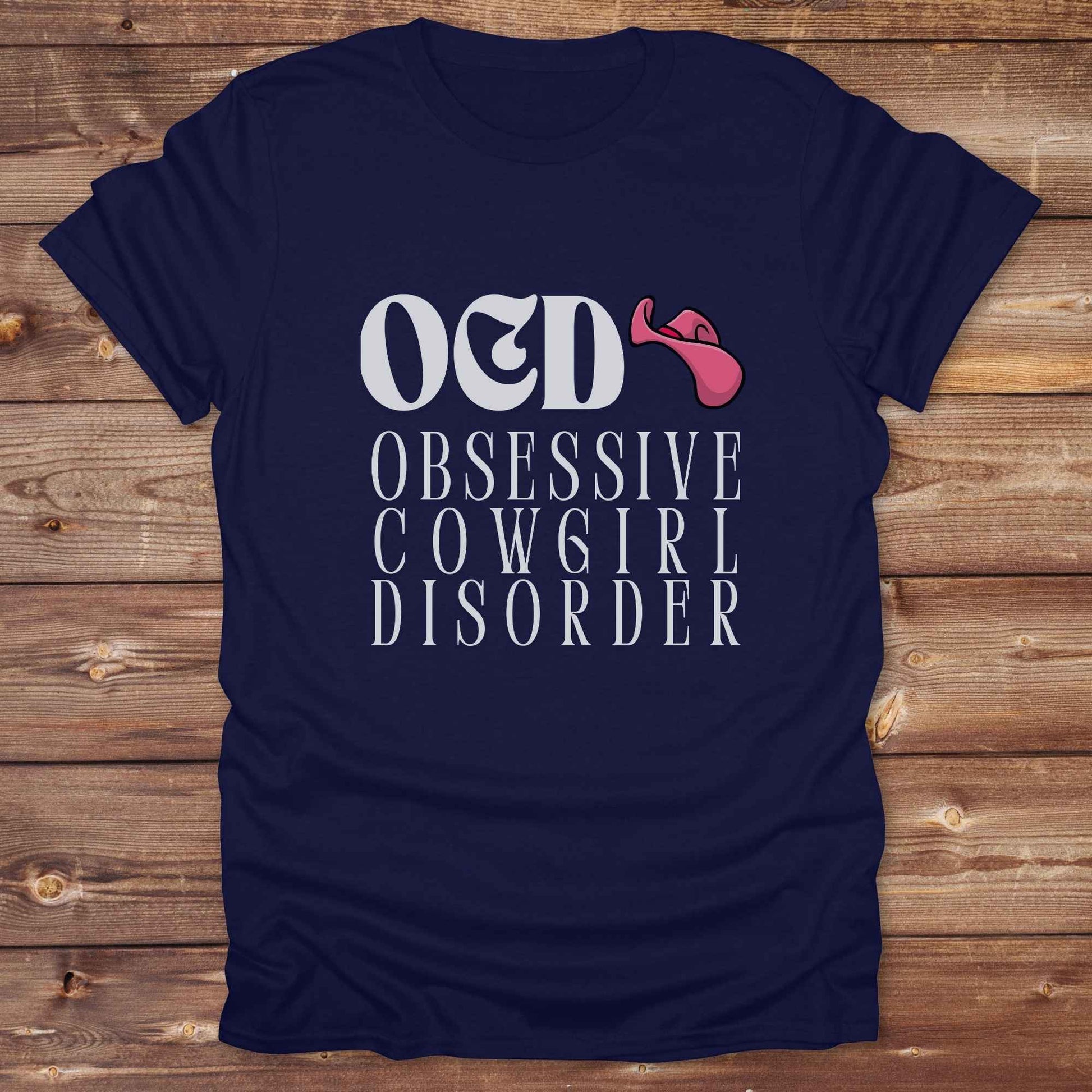 Fun western t-shirt for horse lovers and cowgirls. Western cowgirl graphic tee with horse design. Cowboy humor t-shirt for rodeo and country lovers. Horse lover funny t-shirt with western theme. Country style horse graphic tee for cowboys and cowgirls. Retro style funny western shirt for equestrians. Cute and funny country shirt with horse print. Southern cowgirl funny quote shirt for horse lovers. OCD Cowgirl.