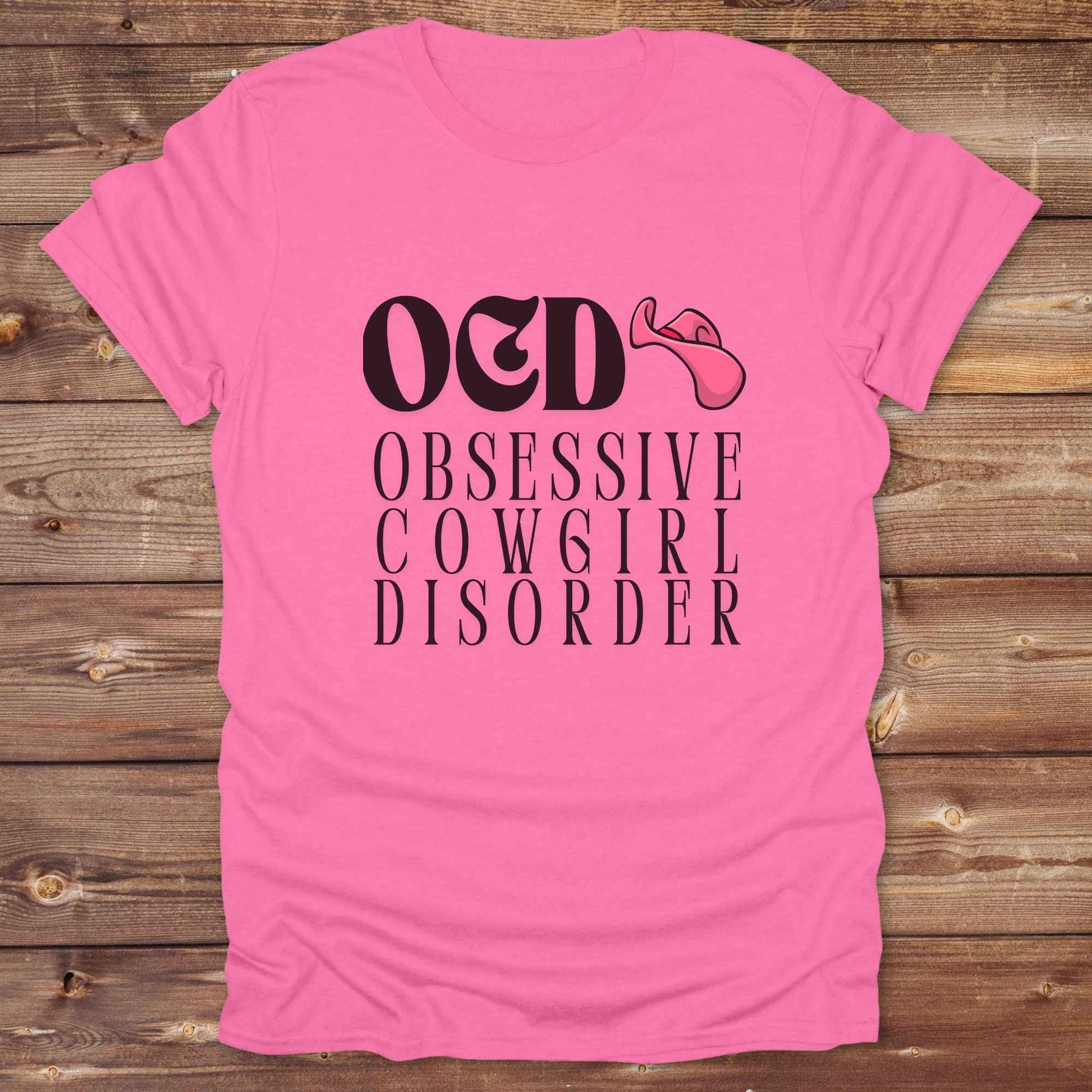 Fun western t-shirt for horse lovers and cowgirls. Western cowgirl graphic tee with horse design. Cowboy humor t-shirt for rodeo and country lovers. Horse lover funny t-shirt with western theme. Country style horse graphic tee for cowboys and cowgirls. Retro style funny western shirt for equestrians. Cute and funny country shirt with horse print. Southern cowgirl funny quote shirt for horse lovers. OCD Cowgirl.