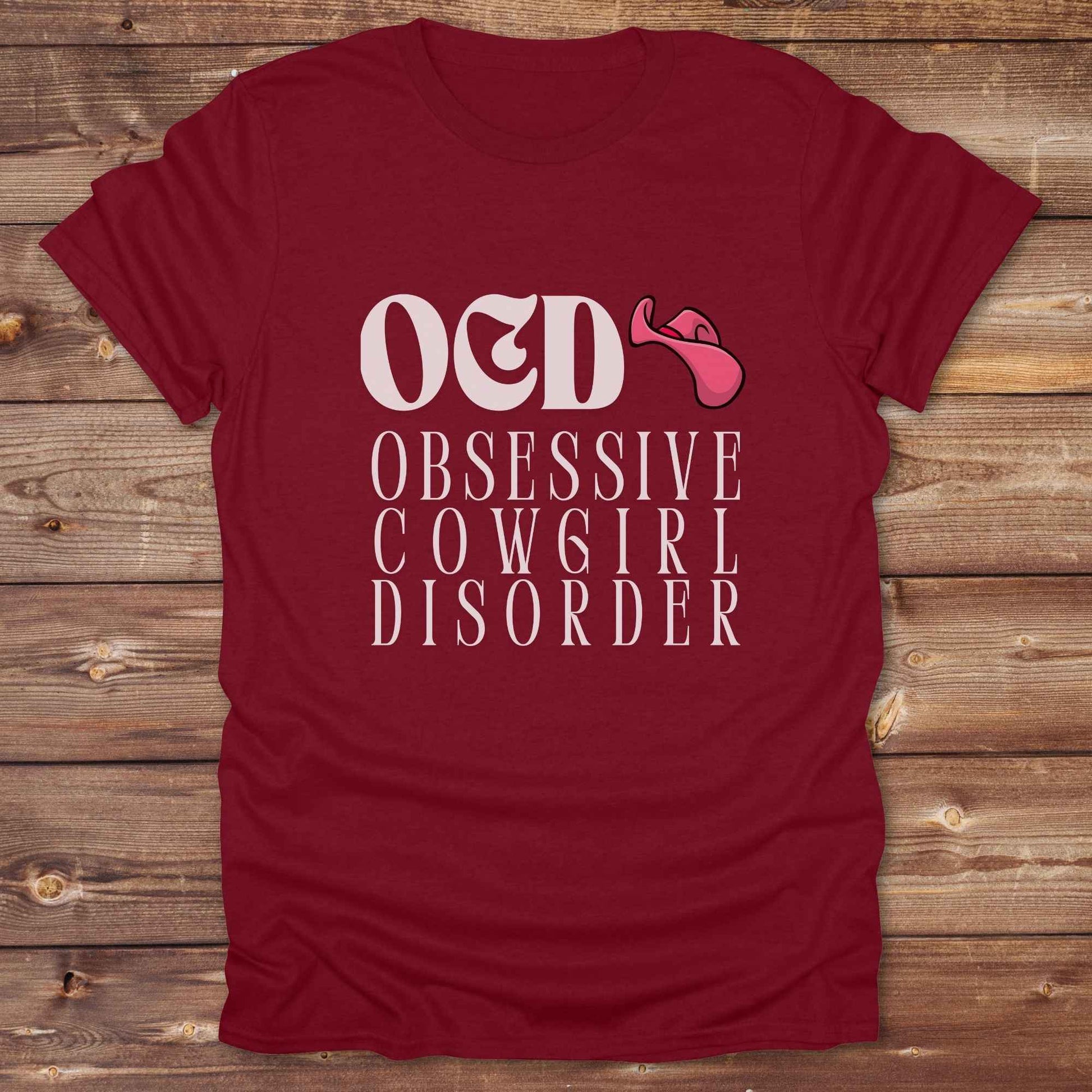 Fun western t-shirt for horse lovers and cowgirls. Western cowgirl graphic tee with horse design. Cowboy humor t-shirt for rodeo and country lovers. Horse lover funny t-shirt with western theme. Country style horse graphic tee for cowboys and cowgirls. Retro style funny western shirt for equestrians. Cute and funny country shirt with horse print. Southern cowgirl funny quote shirt for horse lovers. OCD Cowgirl.