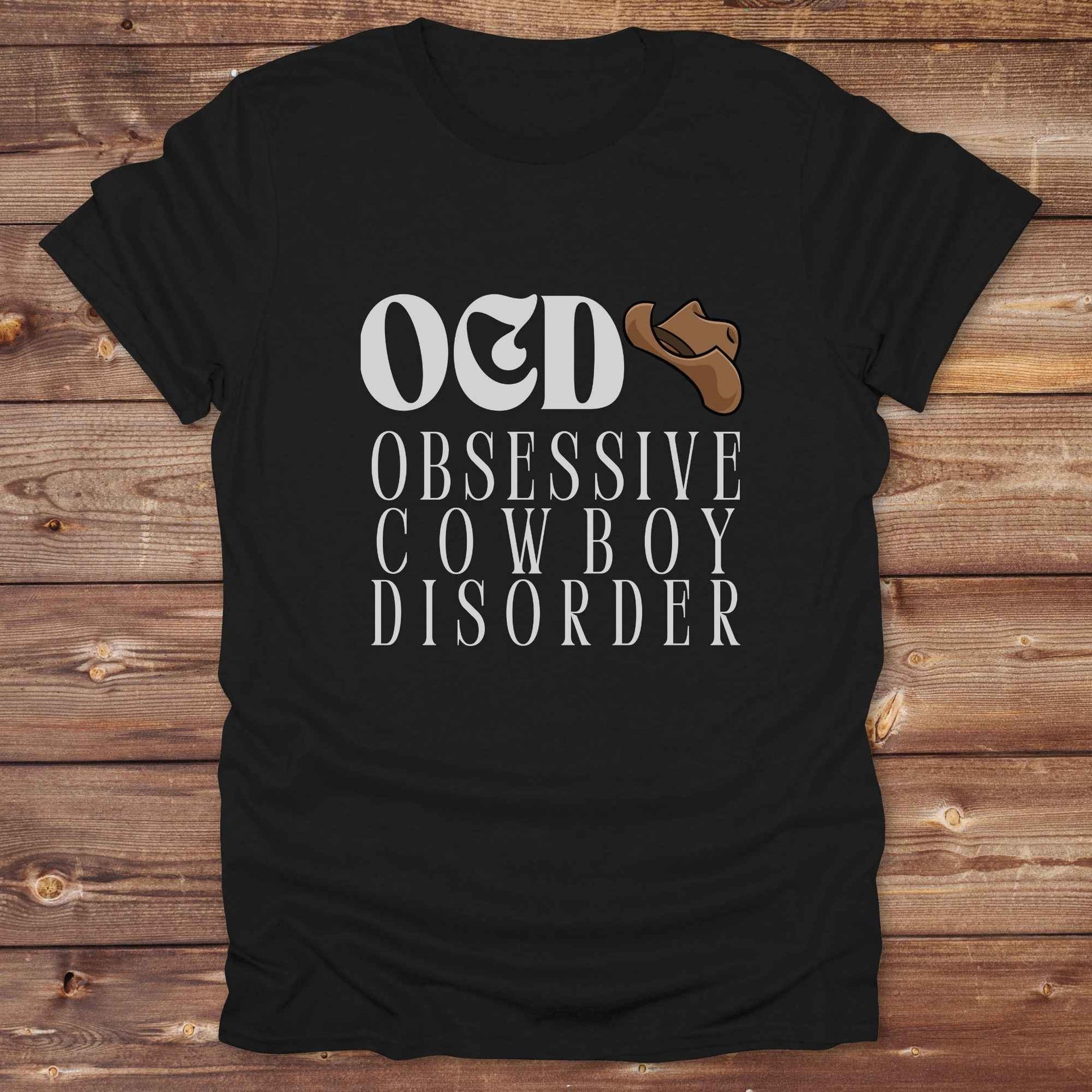 Fun western t-shirt for horse lovers and cowgirls. Western cowgirl graphic tee with horse design. Cowboy humor t-shirt for rodeo and country lovers. Horse lover funny t-shirt with western theme. Country style horse graphic tee for cowboys and cowgirls. Retro style funny western shirt for equestrians. Cute and funny country shirt with horse print. Southern cowgirl funny quote shirt for horse lovers. OCD Cowboy.