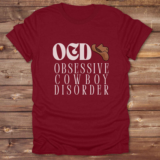 Fun western t-shirt for horse lovers and cowgirls. Western cowgirl graphic tee with horse design. Cowboy humor t-shirt for rodeo and country lovers. Horse lover funny t-shirt with western theme. Country style horse graphic tee for cowboys and cowgirls. Retro style funny western shirt for equestrians. Cute and funny country shirt with horse print. Southern cowgirl funny quote shirt for horse lovers. OCD Cowboy.