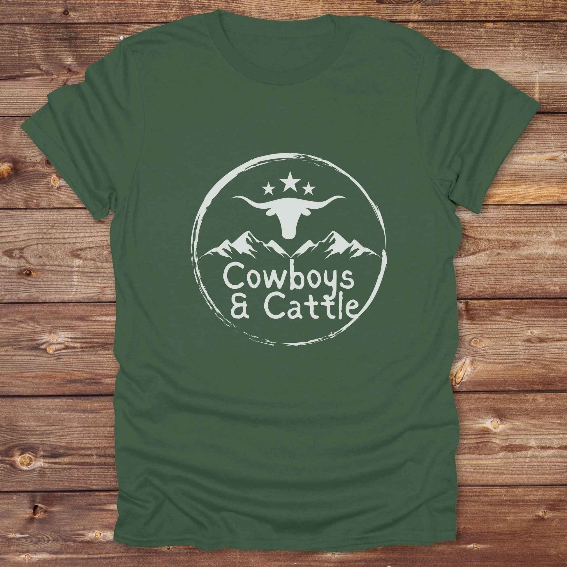 Fun western t-shirt featuring horse themed design for cowgirls, cowboys, horse lovers and equestrians, perfect for rodeo lovers, rustic style fans, and horse people. Unique graphic tee by Lasso and Loom.  Cowboys and cattle with mountain range and longhorn skull.