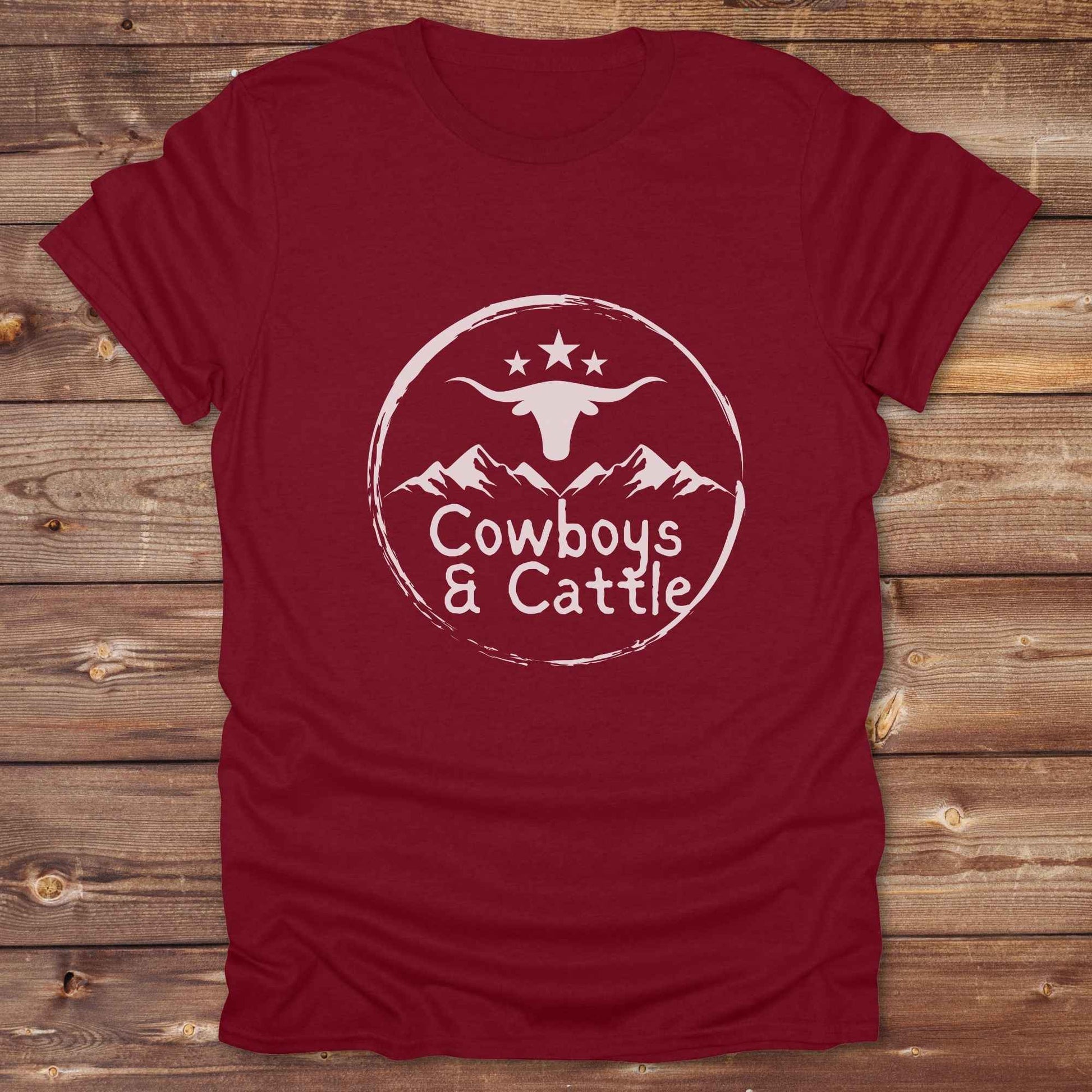 Fun western t-shirt featuring horse themed design for cowgirls, cowboys, horse lovers and equestrians, perfect for rodeo lovers, rustic style fans, and horse people. Unique graphic tee by Lasso and Loom.  Cowboys and cattle with mountain range and longhorn skull.