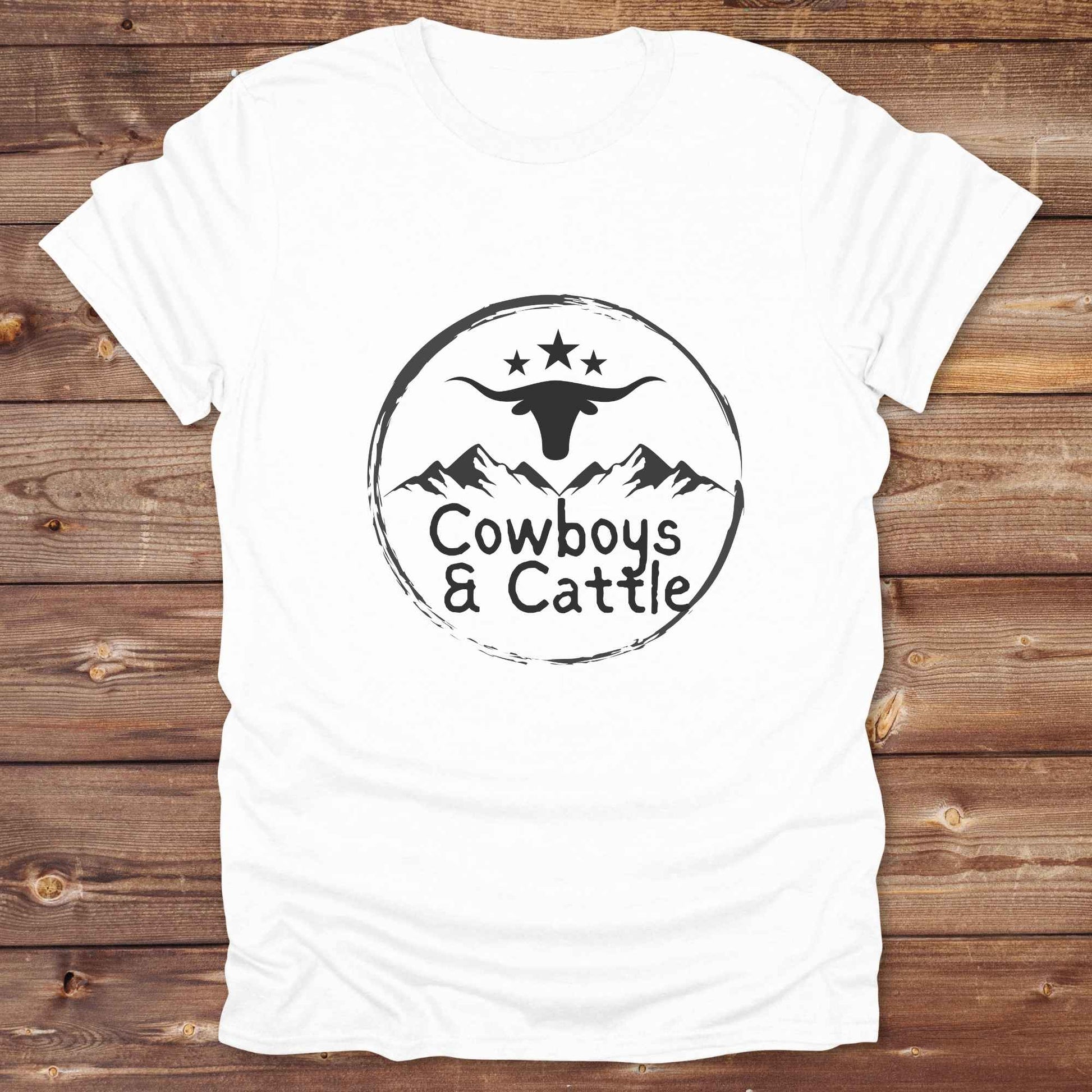 Fun western t-shirt featuring horse themed design for cowgirls, cowboys, horse lovers and equestrians, perfect for rodeo lovers, rustic style fans, and horse people. Unique graphic tee by Lasso and Loom.  Cowboys and cattle with mountain range and longhorn skull.