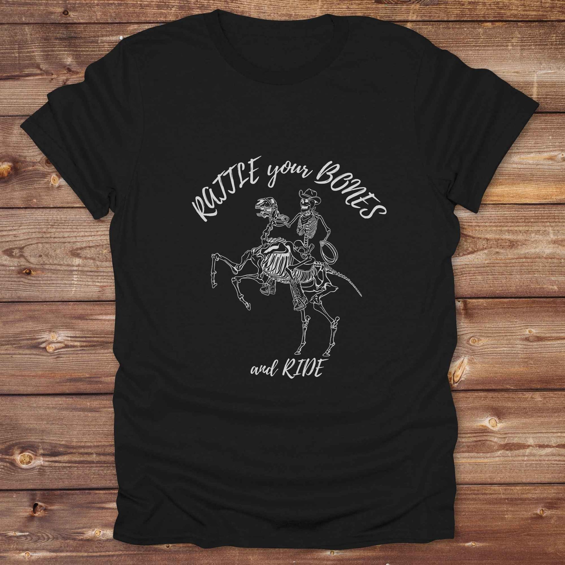 Fun western t-shirt featuring horse themed design for cowgirls, cowboys, horse lovers and equestrians, perfect for rodeo lovers, rustic style fans, and horse people. Unique graphic tee by Lasso and Loom.  Rattle your bones and ride.