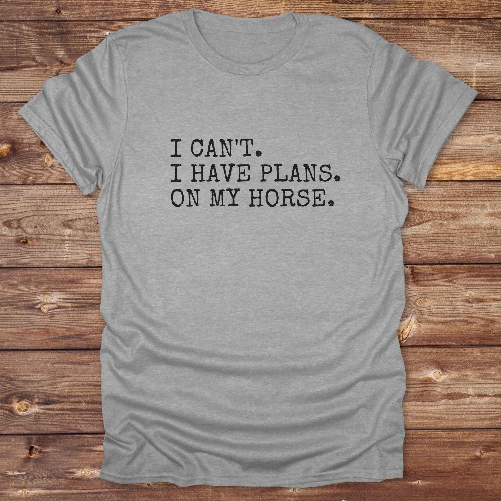 Fun western t-shirt featuring horse themed design for cowgirls, cowboys, horse lovers and equestrians, perfect for rodeo lovers, rustic style fans, and horse people. Unique graphic tee by Lasso and Loom.  I Can't I have plans.