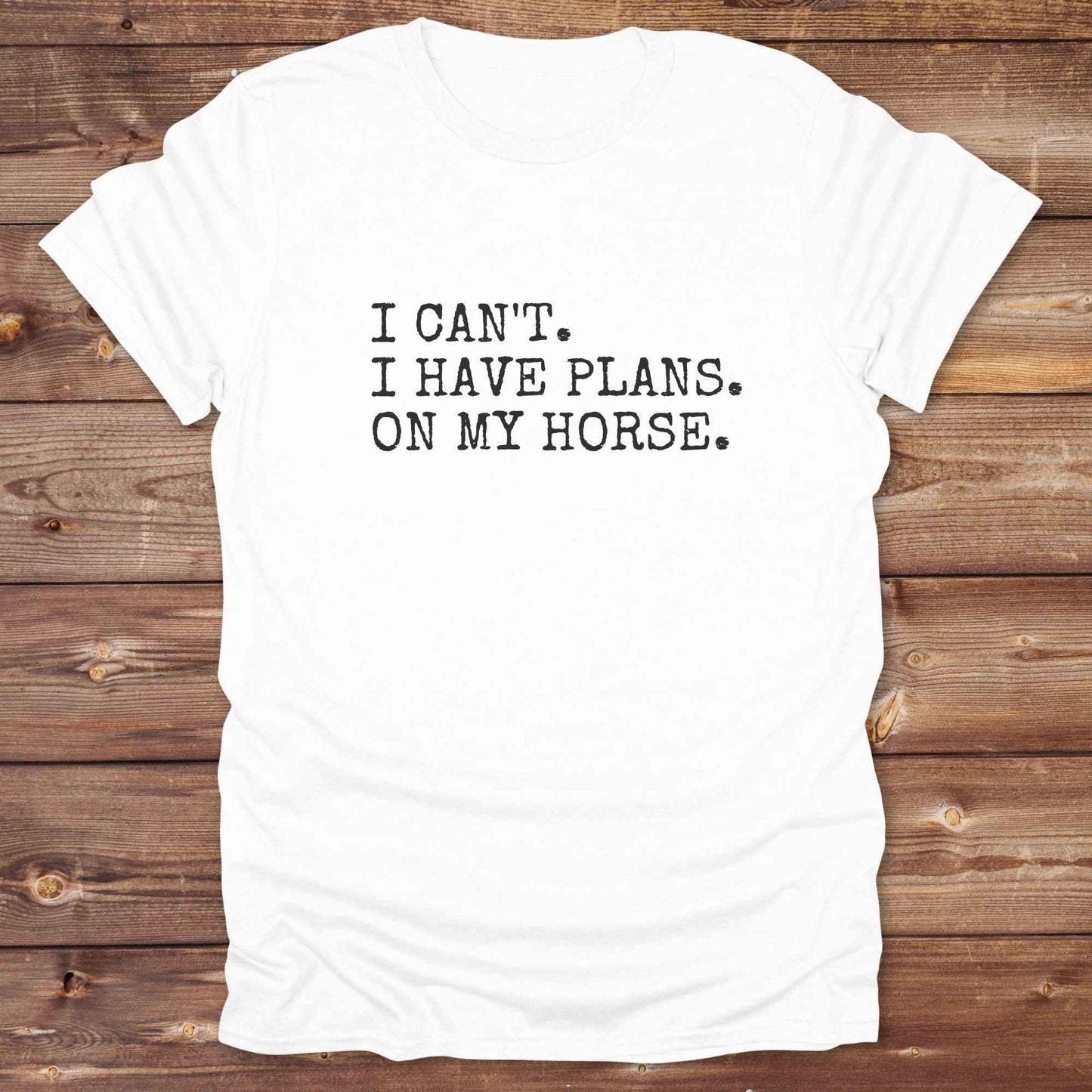 Fun western t-shirt featuring horse themed design for cowgirls, cowboys, horse lovers and equestrians, perfect for rodeo lovers, rustic style fans, and horse people. Unique graphic tee by Lasso and Loom. I Can't I have plans.