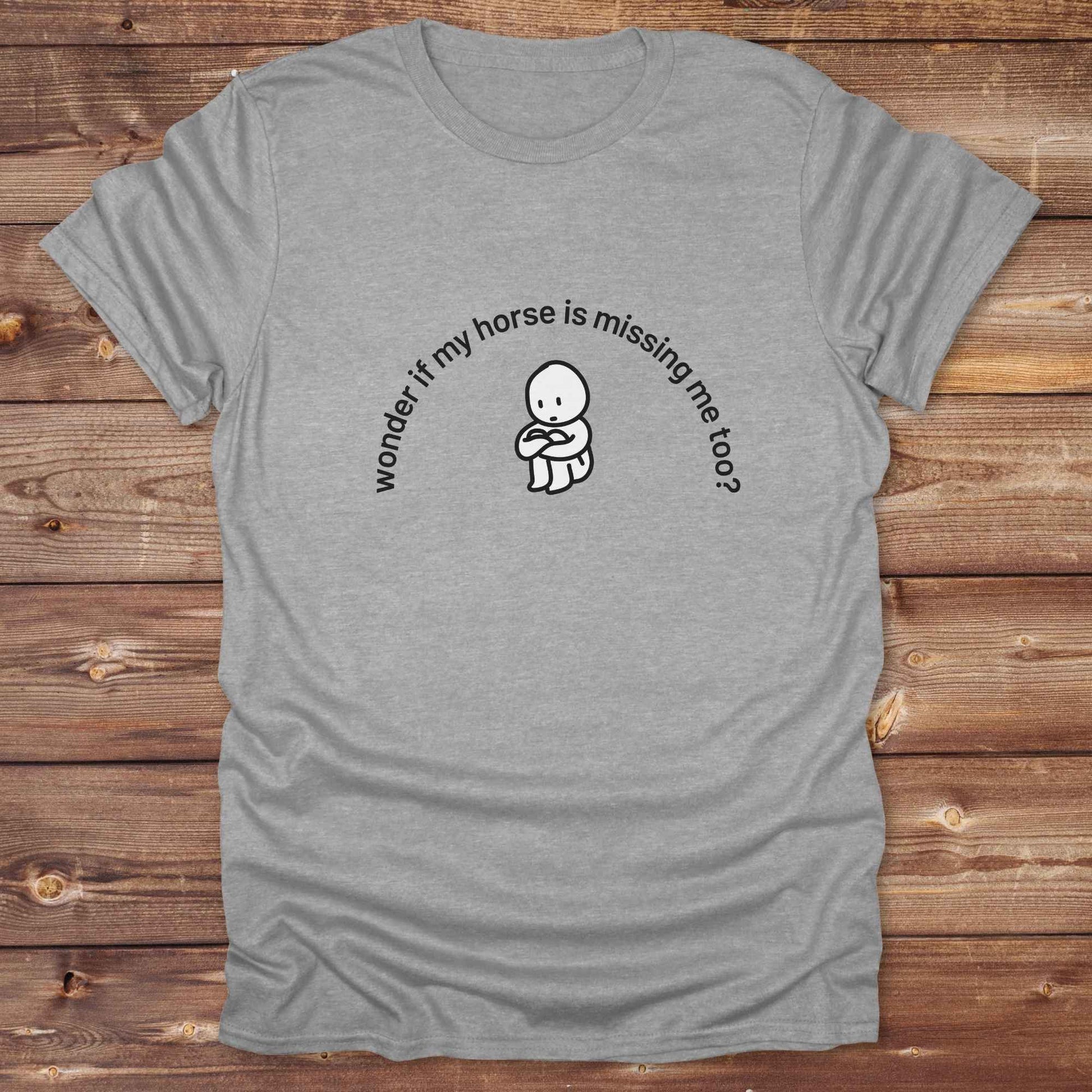 Fun western t-shirt featuring horse themed design for cowgirls, cowboys, horse lovers and equestrians, perfect for rodeo lovers, rustic style fans, and horse people. Unique graphic tee by Lasso and Loom.  Wonder if my horse is missing me too.