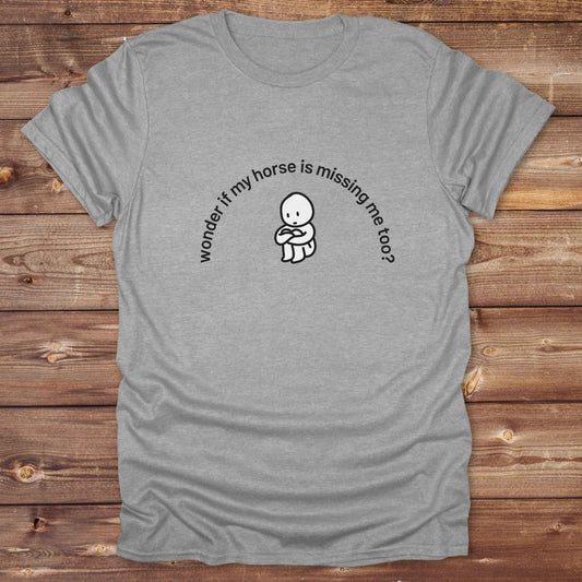 Fun western t-shirt featuring horse themed design for cowgirls, cowboys, horse lovers and equestrians, perfect for rodeo lovers, rustic style fans, and horse people. Unique graphic tee by Lasso and Loom.  Wonder if my horse is missing me too.