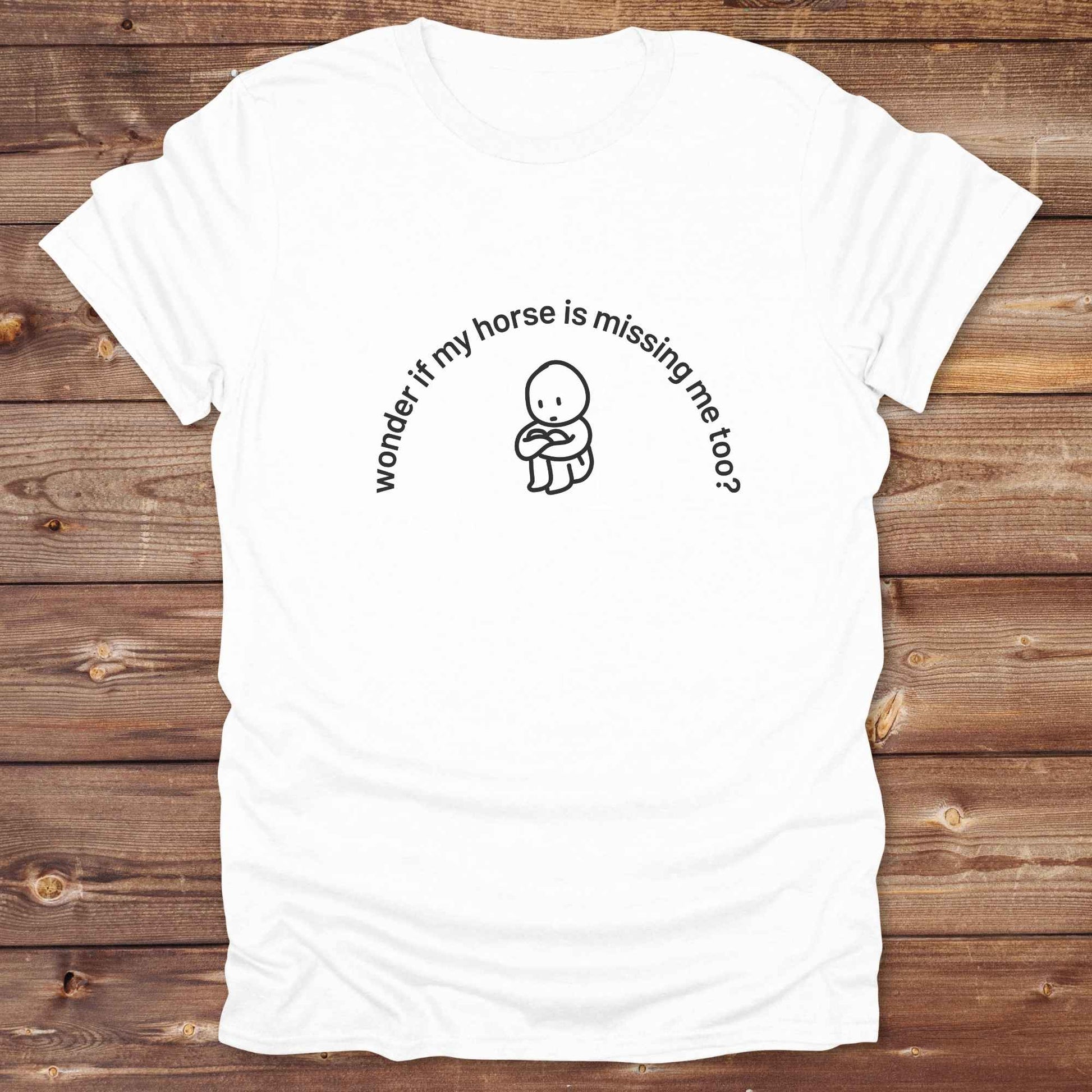 Fun western t-shirt featuring horse themed design for cowgirls, cowboys, horse lovers and equestrians, perfect for rodeo lovers, rustic style fans, and horse people. Unique graphic tee by Lasso and Loom.  Wonder if my horse is missing me too.