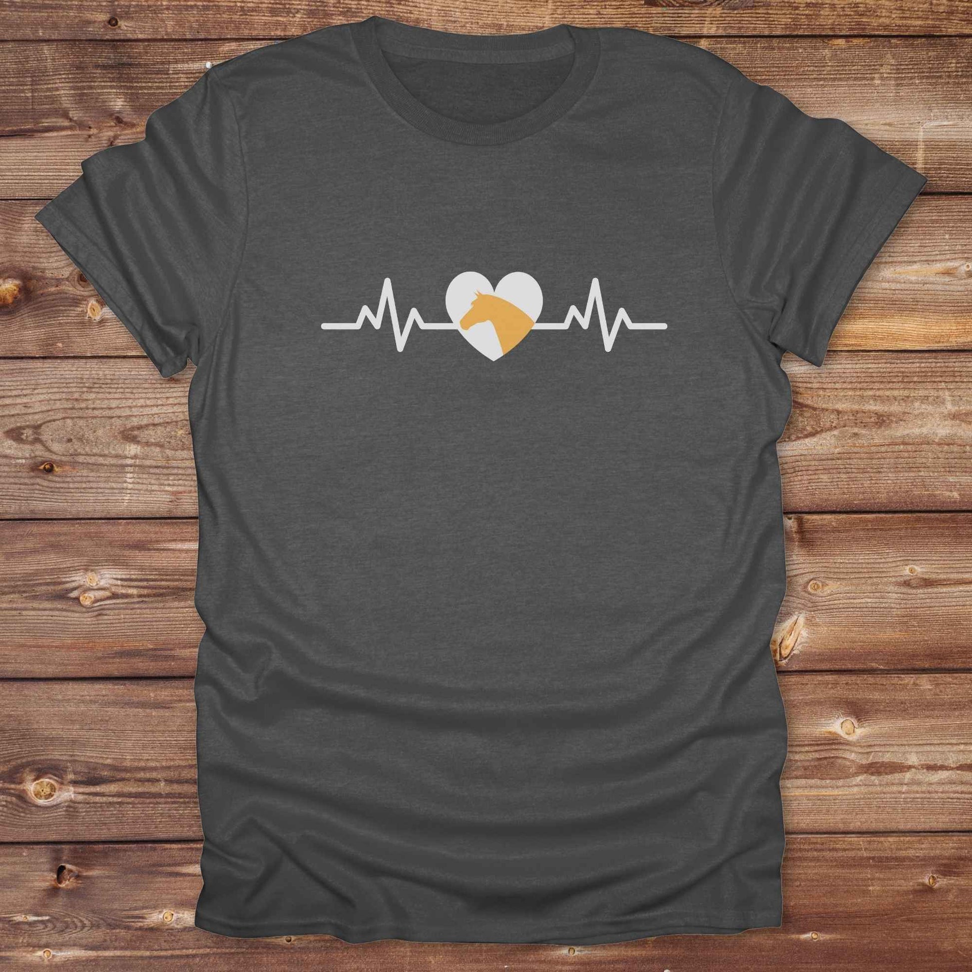 Fun western t-shirt featuring horse themed design for cowgirls, cowboys, horse lovers and equestrians, perfect for rodeo lovers, rustic style fans, and horse people. Unique graphic tee by Lasso and Loom. Heartbeat with a horse in orange.
