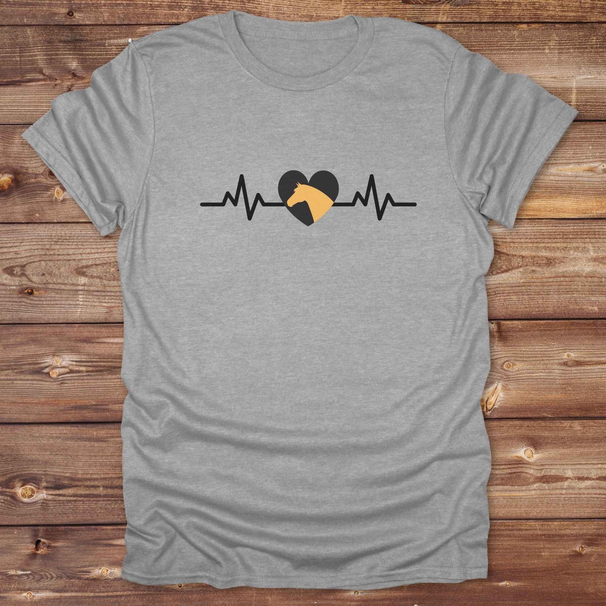 Fun western t-shirt featuring horse themed design for cowgirls, cowboys, horse lovers and equestrians, perfect for rodeo lovers, rustic style fans, and horse people. Unique graphic tee by Lasso and Loom. Heartbeat with a horse in orange.