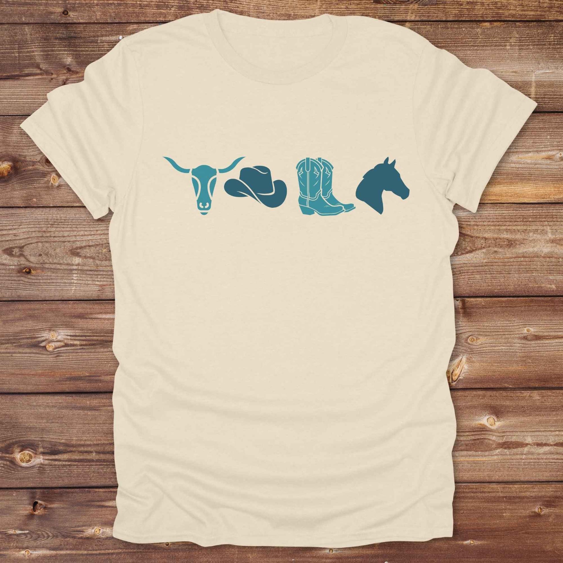 Embrace western vibes with this boho inspired graphic tee, featuring cowboy icons and perfect for horse lovers and rodeo fans. Designed for cowgirls, cowboys, and equestrian souls, Whether you're headed to the rodeo or relaxing at the ranch, this cowboy hat and boots tee adds a bold country aesthetic. Featuring a longhorn skull, cowboy hat, cowboy boots and horse.