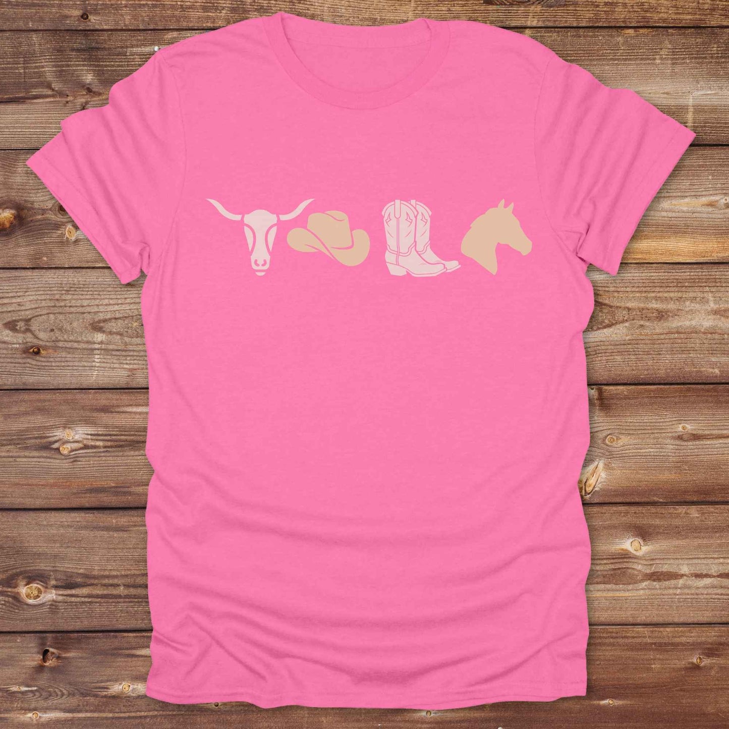 Embrace western vibes with this boho inspired graphic tee, featuring cowboy icons and perfect for horse lovers and rodeo fans. Designed for cowgirls, cowboys, and equestrian souls, Whether you're headed to the rodeo or relaxing at the ranch, this cowboy hat and boots tee adds a bold country aesthetic. Featuring a longhorn skull, cowboy hat, cowboy boots and horse.