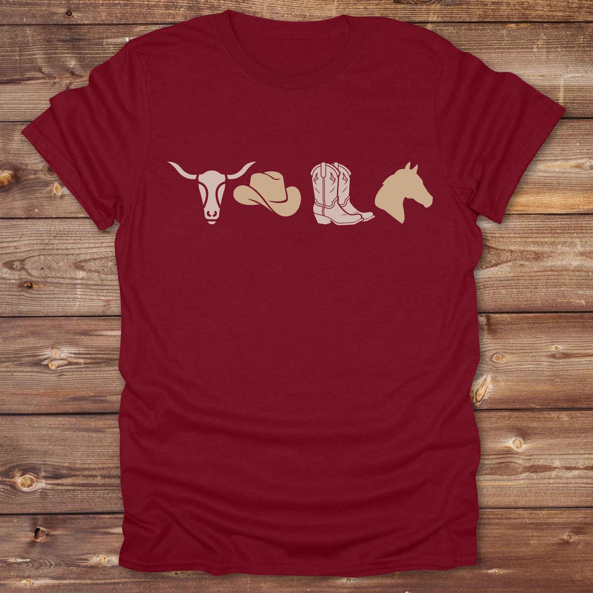 Embrace western vibes with this boho inspired graphic tee, featuring cowboy icons and perfect for horse lovers and rodeo fans. Designed for cowgirls, cowboys, and equestrian souls, Whether you're headed to the rodeo or relaxing at the ranch, this cowboy hat and boots tee adds a bold country aesthetic. Featuring a longhorn skull, cowboy hat, cowboy boots and horse.