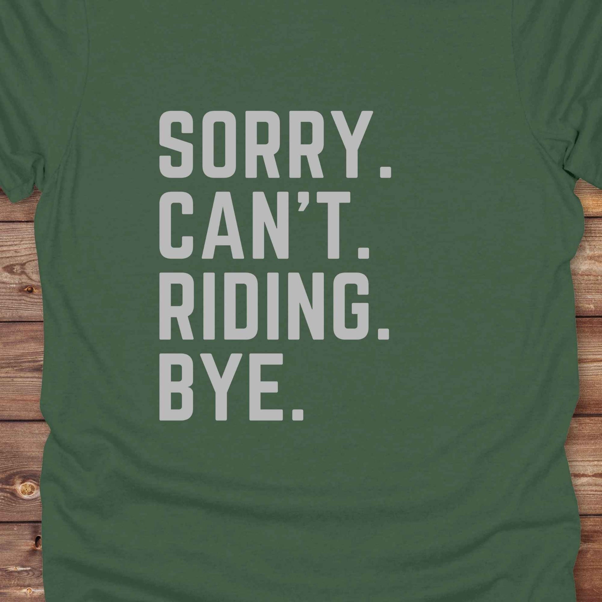This “Sorry Can’t. Riding. Bye.” western typography tee is the perfect gift for horse lovers, trail riders, and anyone living the cowboy or cowgirl lifestyle. Made from premium Gildan 64000 cotton, it's unisex and available in 8 colors to match your cowboy core aesthetic. Whether you're off to a rodeo, riding horses, or just showing off your rustic humor, this bold minimalist horse quote shirt delivers personality and comfort. Great for birthdays, western lovers, and equestrian fashion fans.