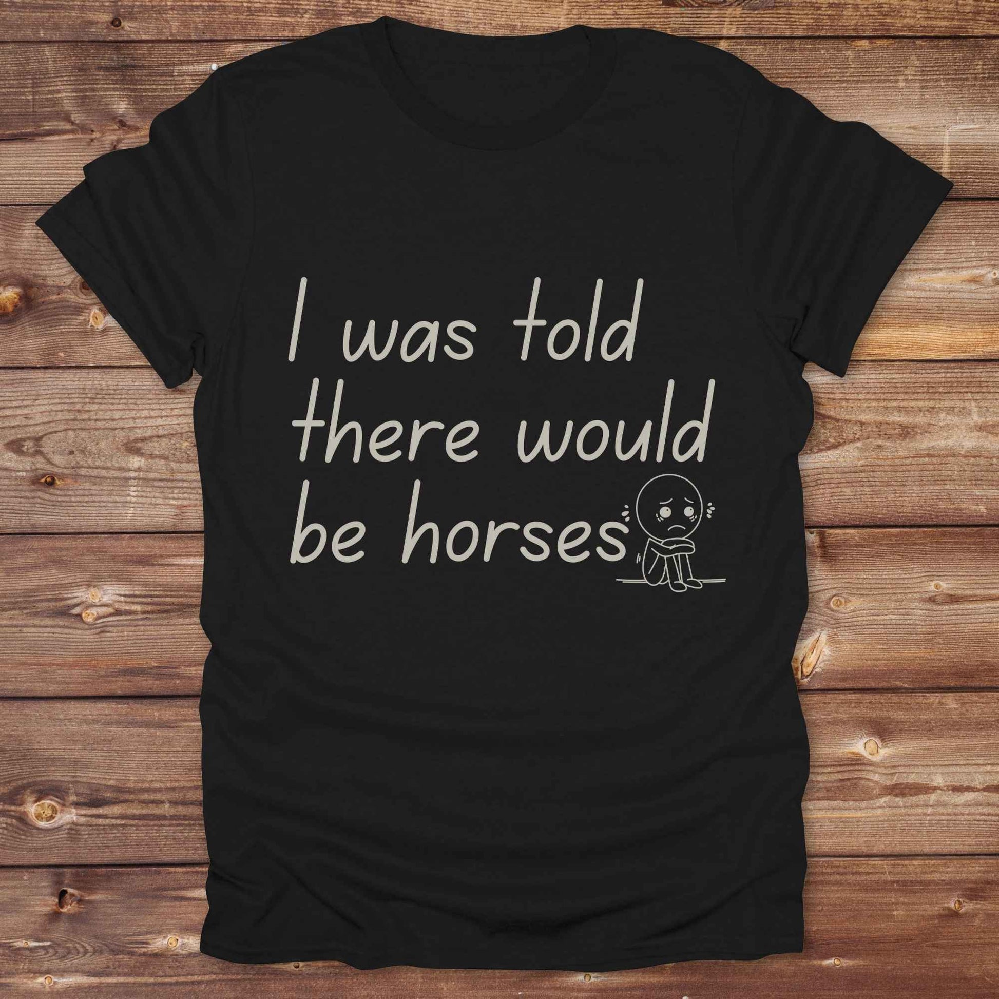"I Was Told There Would Be Horses” t-shirt blends western humor with country sarcasm, making it a perfect gift for horse lovers, cowboys, and cowgirls alike. It features a bold quote and a sad cartoon face, adding personality and rustic charm to your cowboy core wardrobe. Whether you're headed to a rodeo, riding event, country fair, or just living that barn life, this shirt brings the laughs and the style. It’s a great birthday gift, rodeo tee, or daily wear.