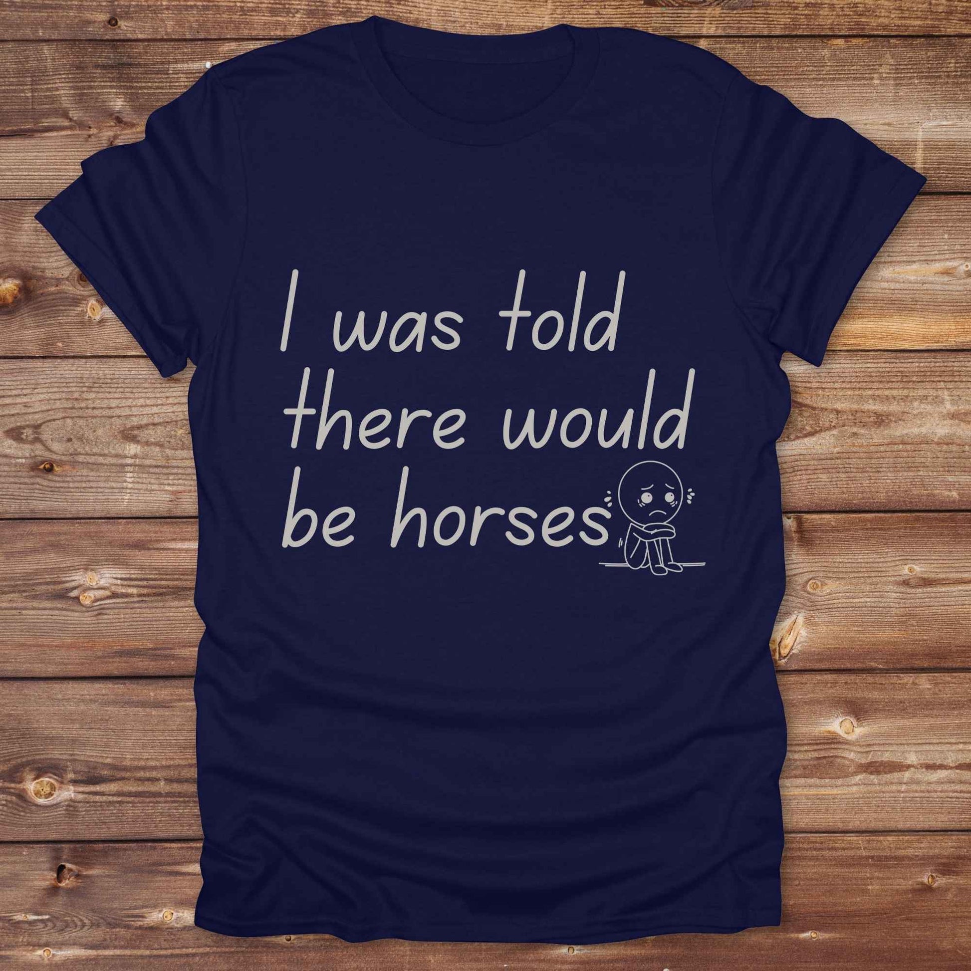 "I Was Told There Would Be Horses” t-shirt blends western humor with country sarcasm, making it a perfect gift for horse lovers, cowboys, and cowgirls alike. It features a bold quote and a sad cartoon face, adding personality and rustic charm to your cowboy core wardrobe. Whether you're headed to a rodeo, riding event, country fair, or just living that barn life, this shirt brings the laughs and the style. It’s a great birthday gift, rodeo tee, or daily wear.