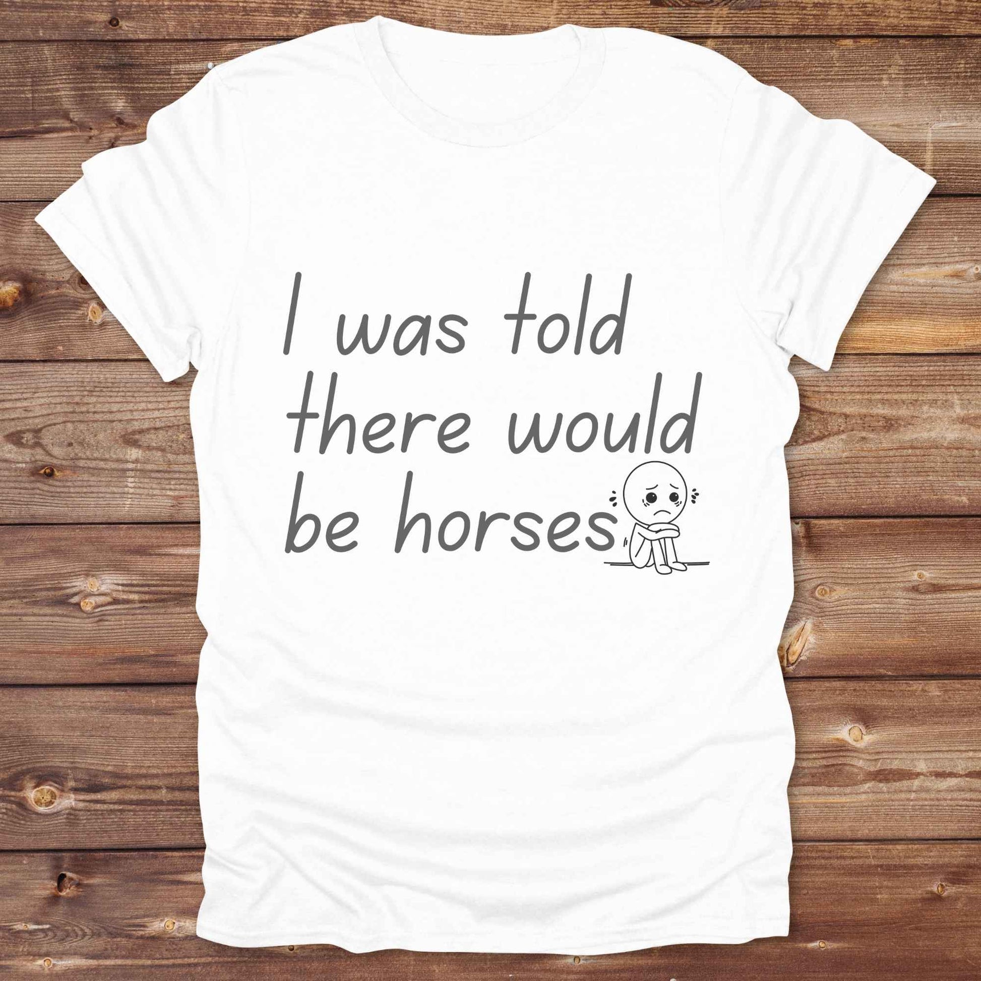 "I Was Told There Would Be Horses” t-shirt blends western humor with country sarcasm, making it a perfect gift for horse lovers, cowboys, and cowgirls alike. It features a bold quote and a sad cartoon face, adding personality and rustic charm to your cowboy core wardrobe. Whether you're headed to a rodeo, riding event, country fair, or just living that barn life, this shirt brings the laughs and the style. It’s a great birthday gift, rodeo tee, or daily wear.