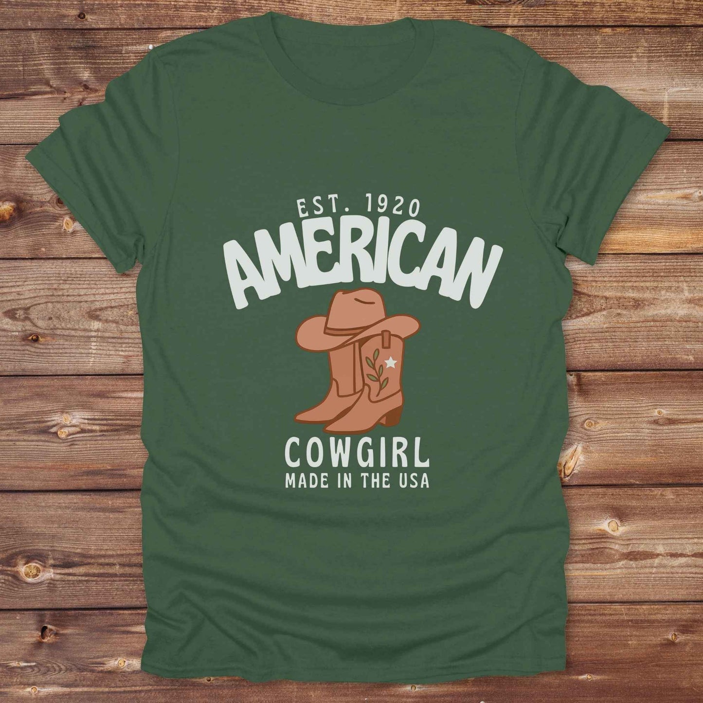 This American Cowgirl T-Shirt is the perfect mix of bold western pride and boho rodeo style. Featuring a rustic boot and hat graphic, it's made for country girls who live for rodeo season and horse rides. It’s a statement piece for cowgirls, country lovers, and western fashion fans alike. Whether you’re gifting it for a birthday or styling it for your next state fair, this tee brings serious cowboy core energy to your closet. A must have for horse lovers.