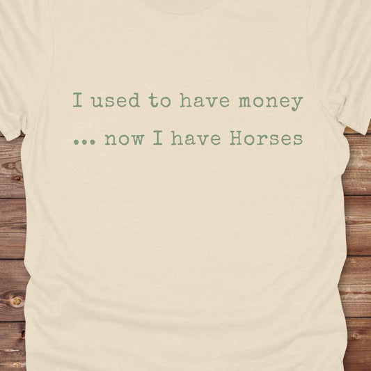 This “I Used to Have Money… Now I Have Horses” tee is made for cowgirls, cowboys, and equestrians who know the true cost of horse life and still love it. Perfect for barn days, rodeo weekends, or country fairs, this shirt brings horse humor to your everyday wardrobe. t’s a hilarious gift for horse lovers, horse moms, ranch workers, and anyone whose paycheck goes straight to hay.