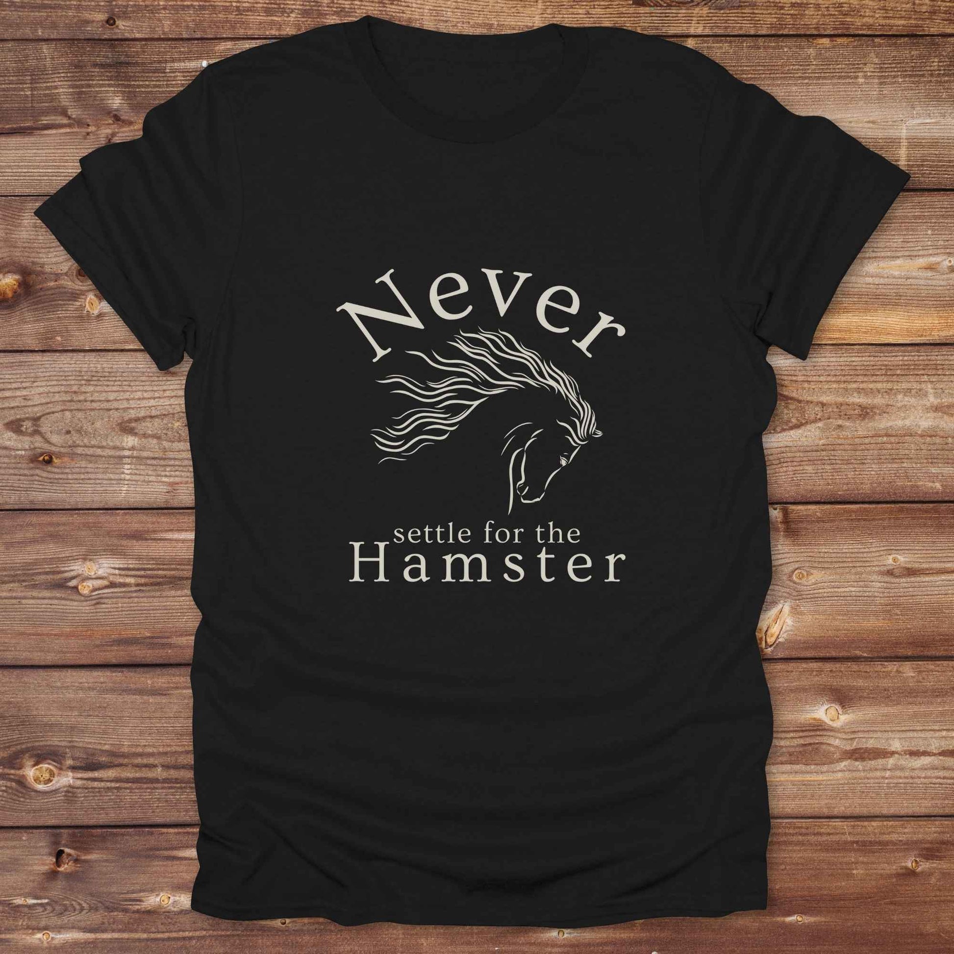 "Never Settle for the Hamster" T-shirt a funny and empowering western tee designed for horse lovers, cowgirls, and cowboy humor fans. Bold typography and flowing horse graphic, perfect for rodeo events, country fairs, or everyday ranch life. Whether you're buying for yourself or gifting to a wild-hearted horse girl, this shirt makes a statement that’s as fierce as your spirit.