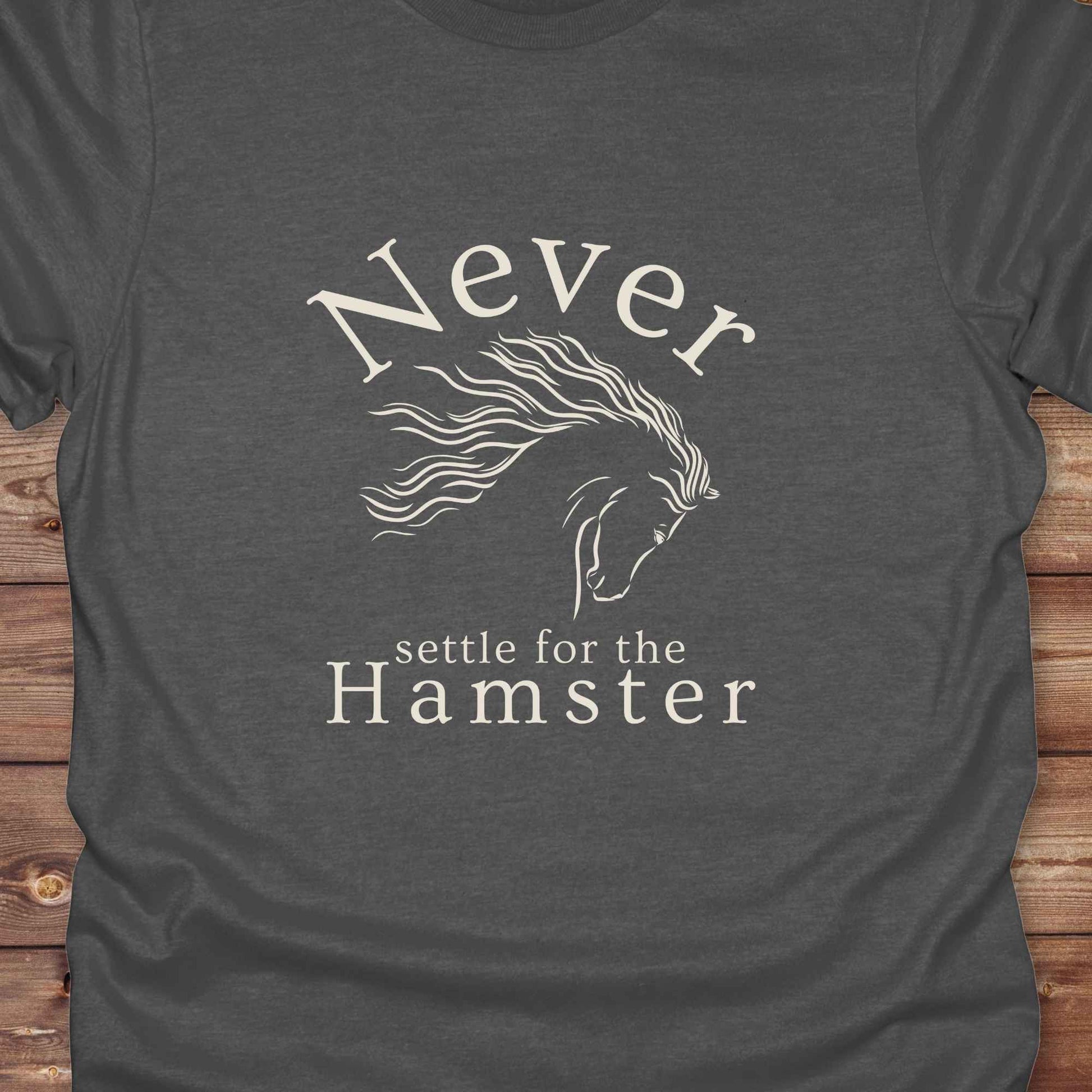 "Never Settle for the Hamster" T-shirt a funny and empowering western tee designed for horse lovers, cowgirls, and cowboy humor fans. Bold typography and flowing horse graphic, perfect for rodeo events, country fairs, or everyday ranch life. Whether you're buying for yourself or gifting to a wild-hearted horse girl, this shirt makes a statement that’s as fierce as your spirit.